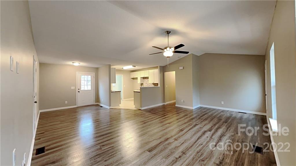 170 State Park Road Troutman, NC 28166 - Photo 2 of 11 a view of an empty room with wooden floor