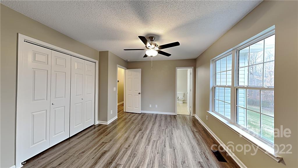 170 State Park Road Troutman, NC 28166 - Photo 5 of 11 a view of an empty room with wooden floor and a window