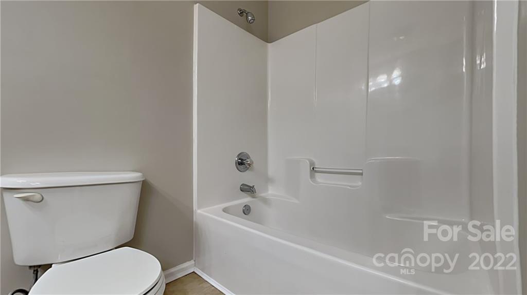 170 State Park Road Troutman, NC 28166 - Photo 7 of 11 a white toilet sitting next to a bath tub