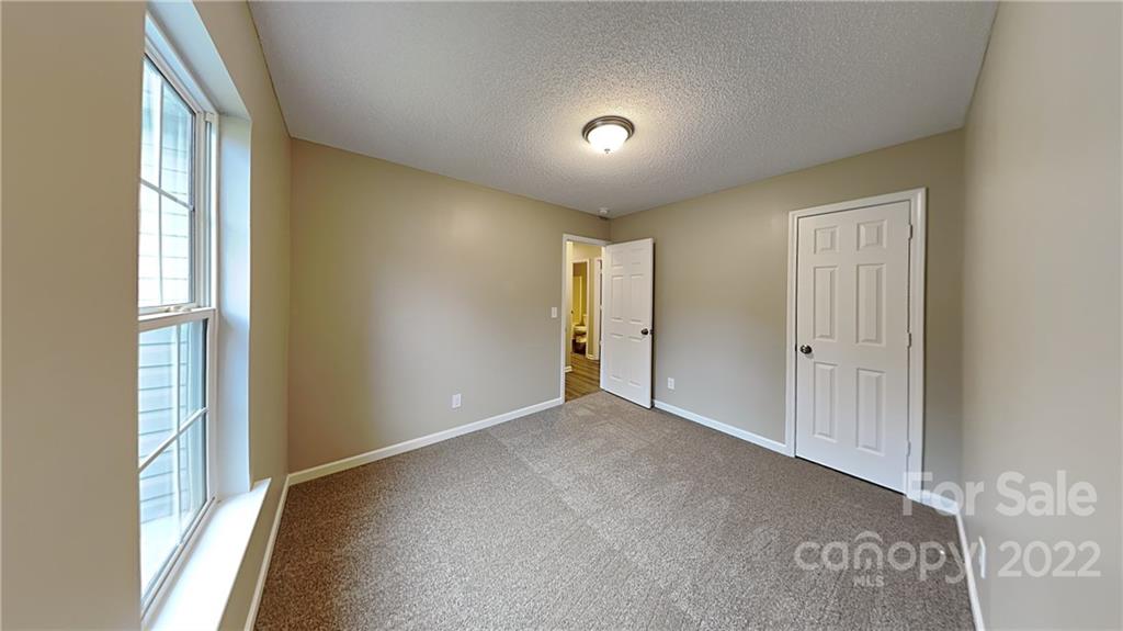 170 State Park Road Troutman, NC 28166 - Photo 9 of 11 a view of hallway with windows