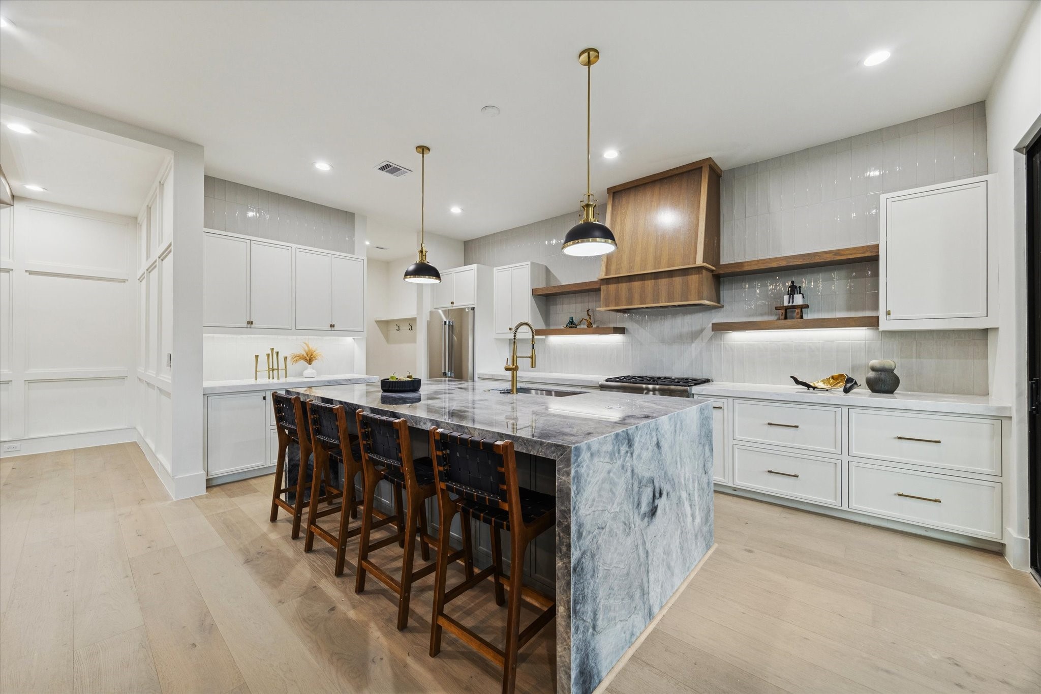 614 Eleanor Street Houston, TX 77009 - Photo 17 of 43 a kitchen with kitchen island granite countertop a sink a stove and a refrigerator