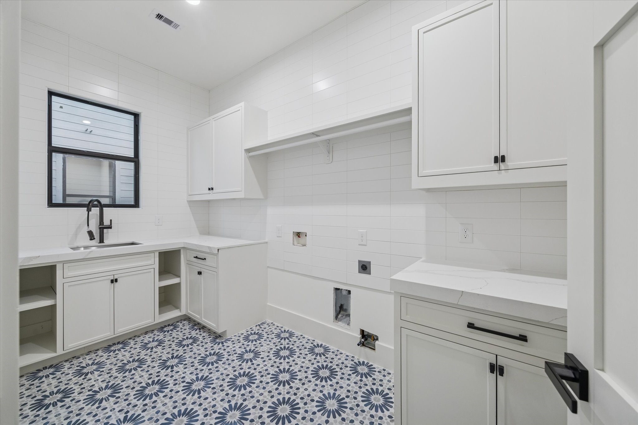 614 Eleanor Street Houston, TX 77009 - Photo 37 of 43 a kitchen with a sink and cabinets