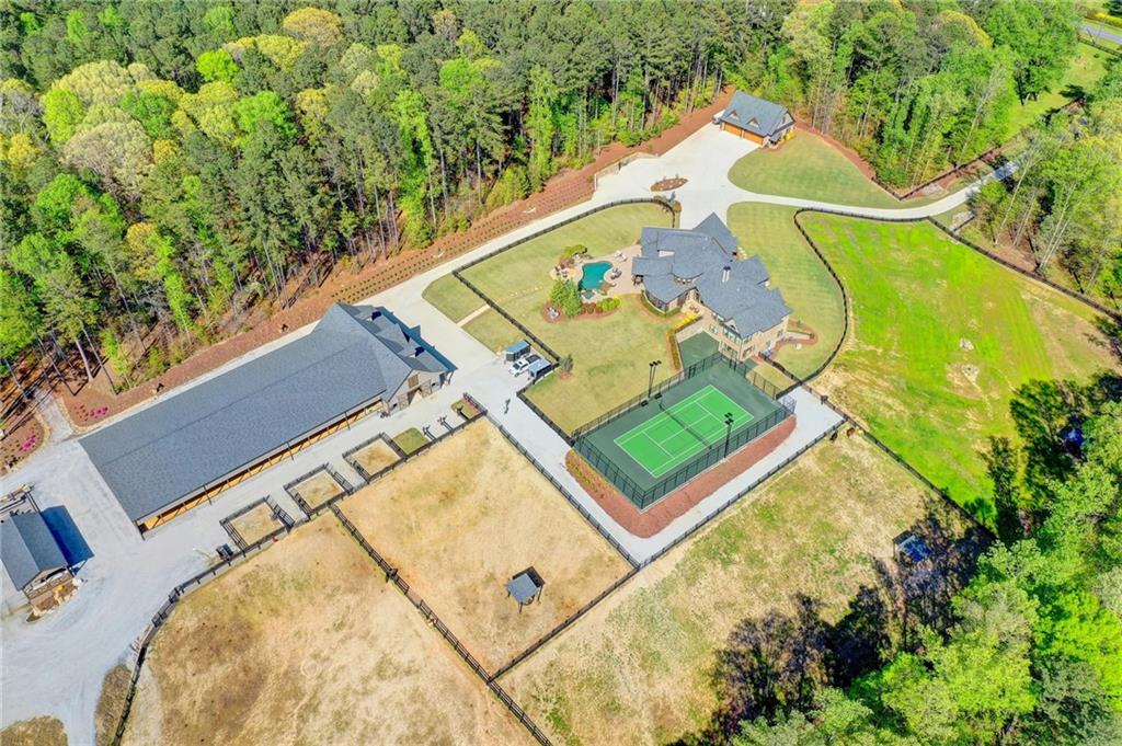 1327 Ewing Chapel Road Dacula, GA 30019 - Photo 1 of 1 an aerial view of a house with a swimming pool
