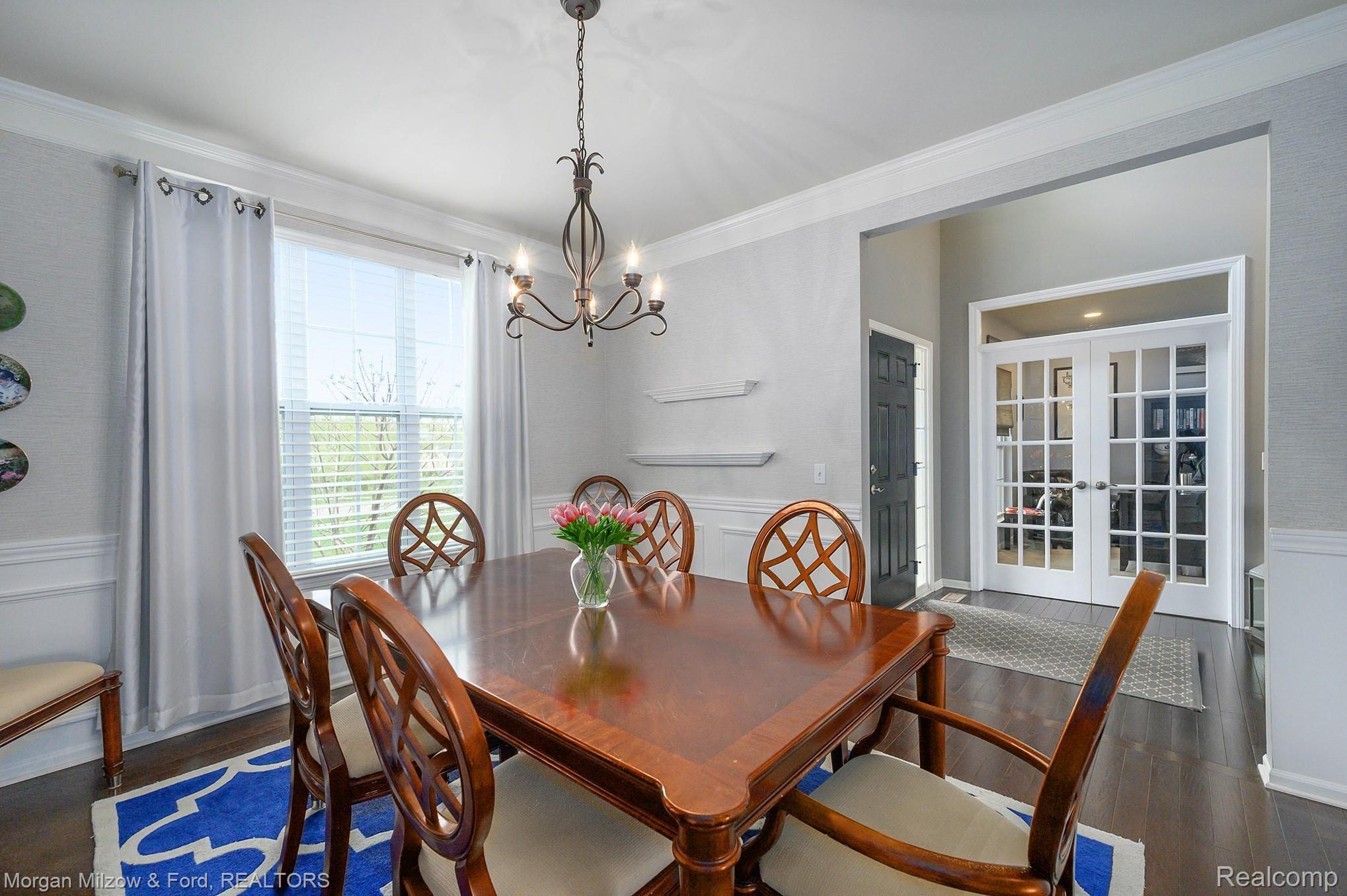 7005 Oakhurst Ridge Road Clarkston, MI 48348 - Photo 18 of 56 Formal dining room with wainscoting