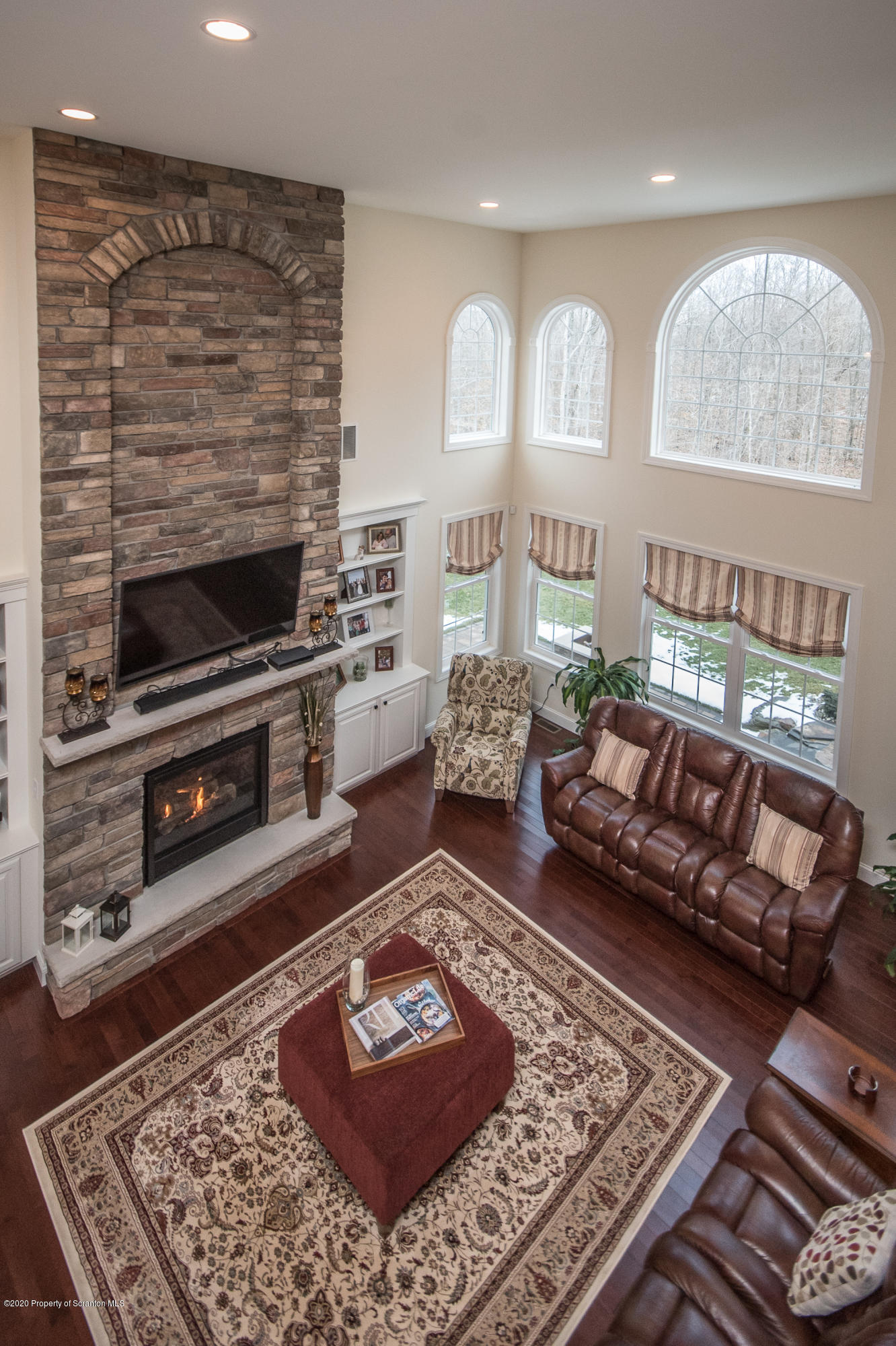 121 Highland Road Moscow, PA 18444 - Photo 11 of 93 a living room with furniture and a fireplace