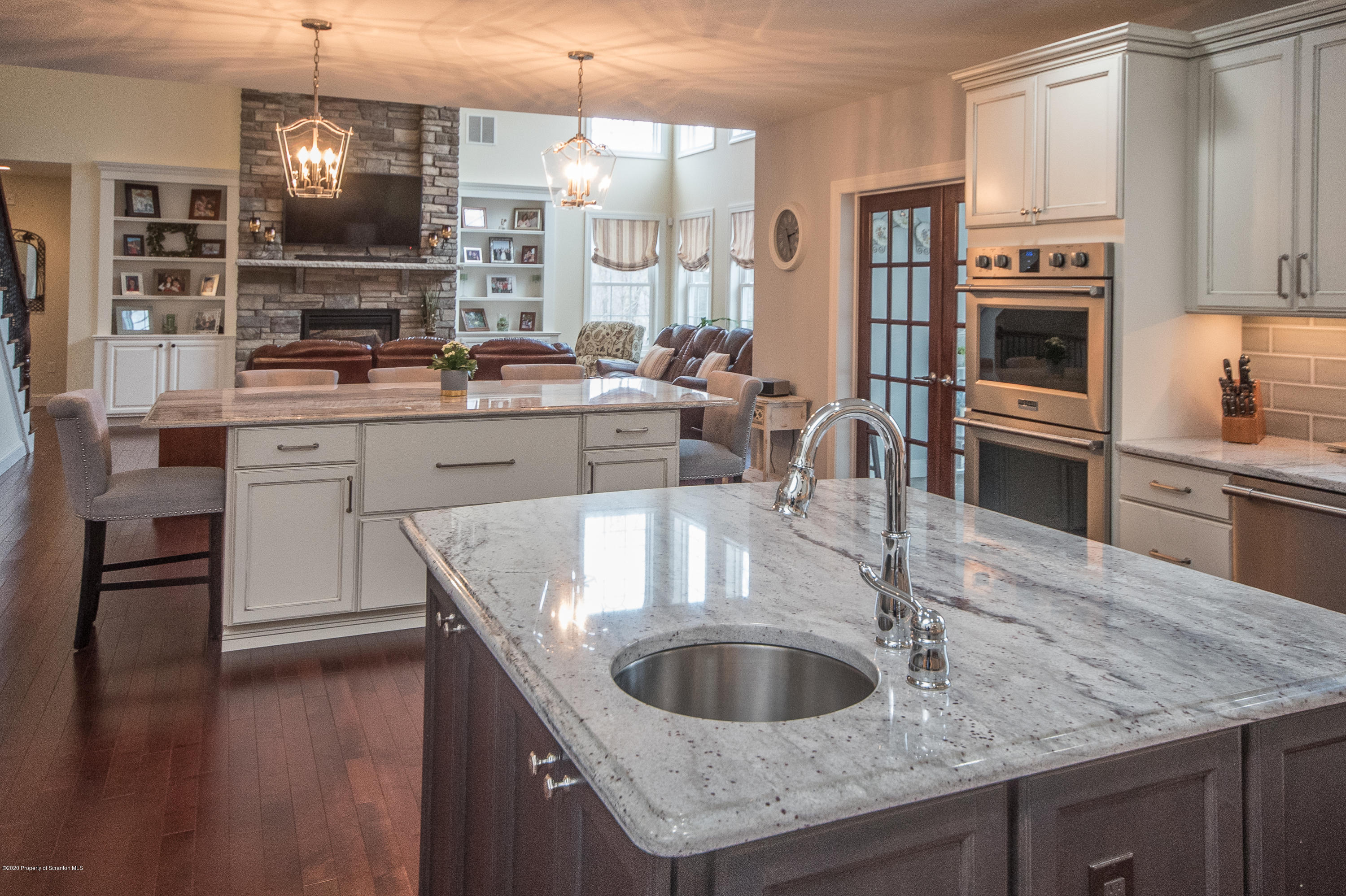 121 Highland Road Moscow, PA 18444 - Photo 21 of 93 a kitchen with kitchen island granite countertop a sink a counter space stainless steel appliances and cabinets