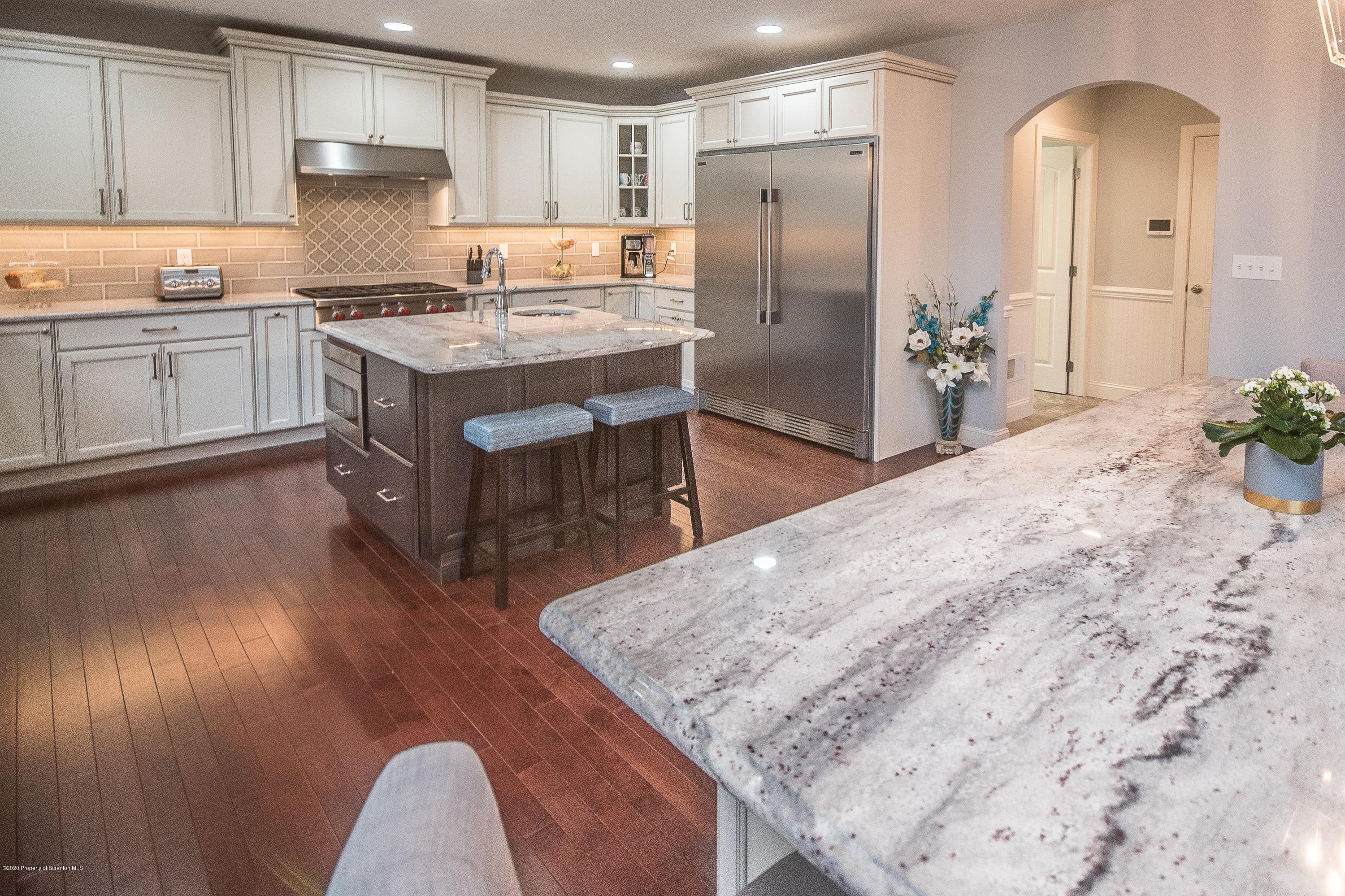 121 Highland Road Moscow, PA 18444 - Photo 26 of 93 a kitchen with stainless steel appliances granite countertop a sink stove and refrigerator