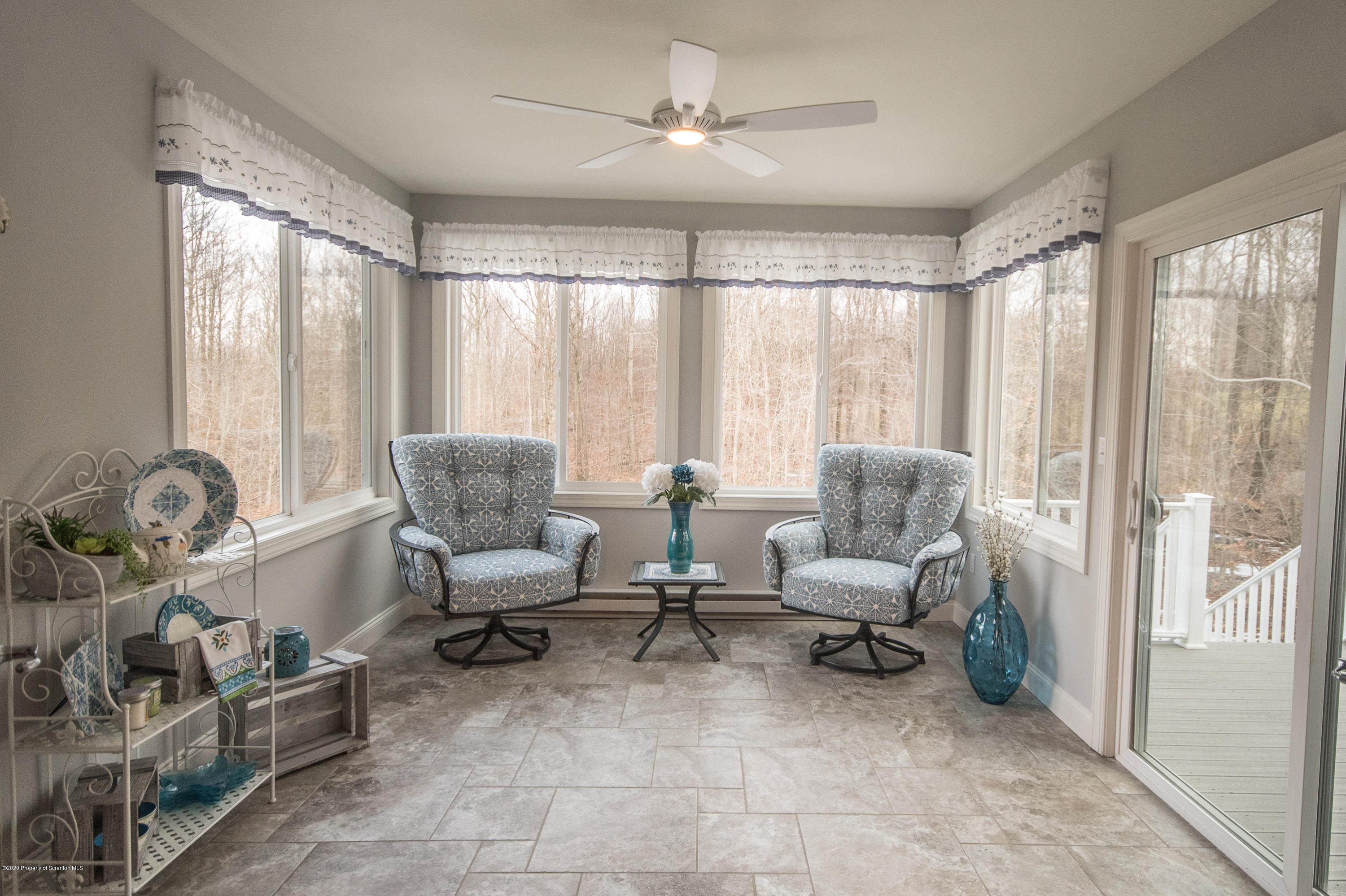 121 Highland Road Moscow, PA 18444 - Photo 41 of 93 a living room with furniture and a large window