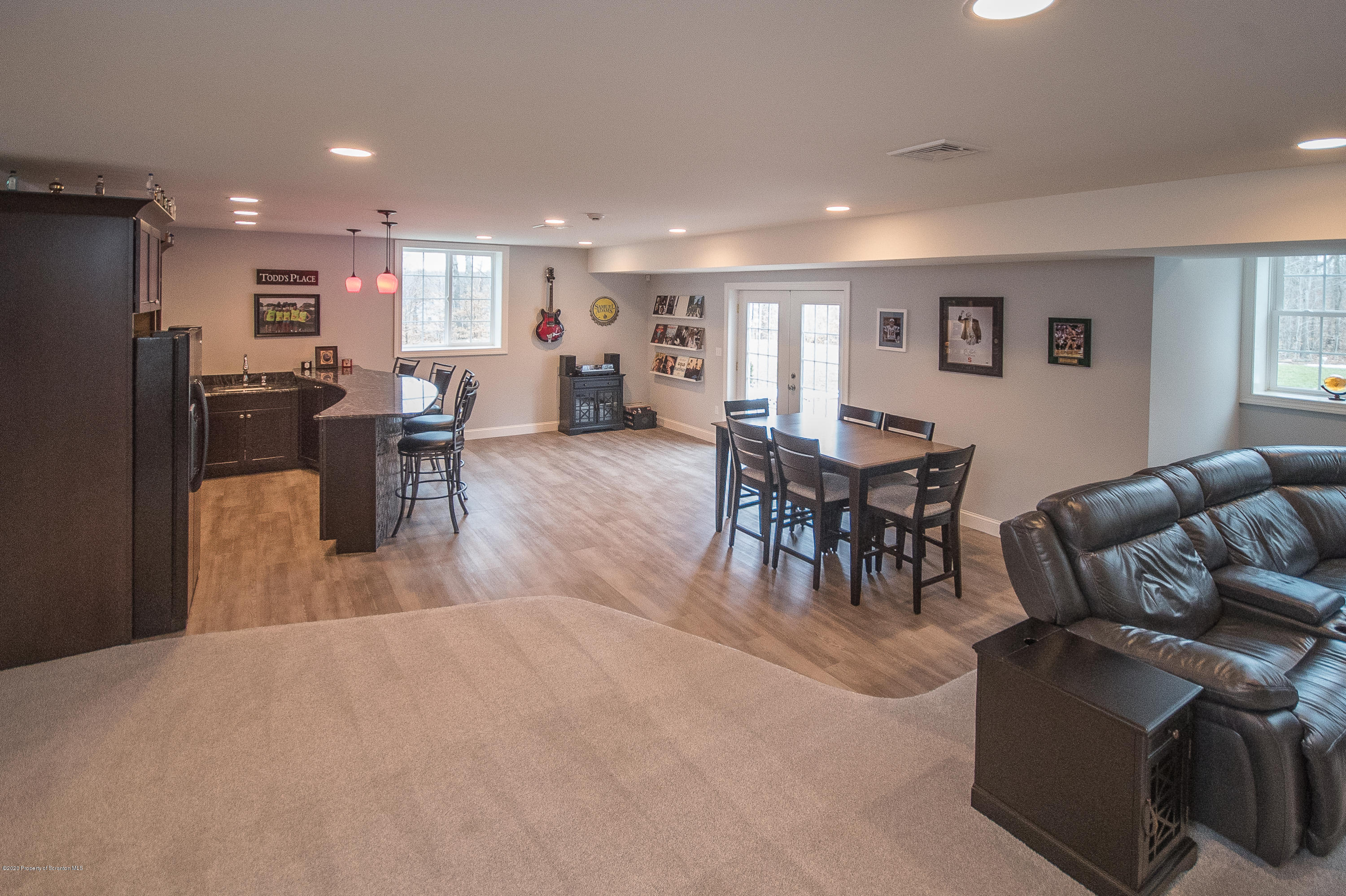 121 Highland Road Moscow, PA 18444 - Photo 42 of 93 a living room with furniture a dining table and a piano table