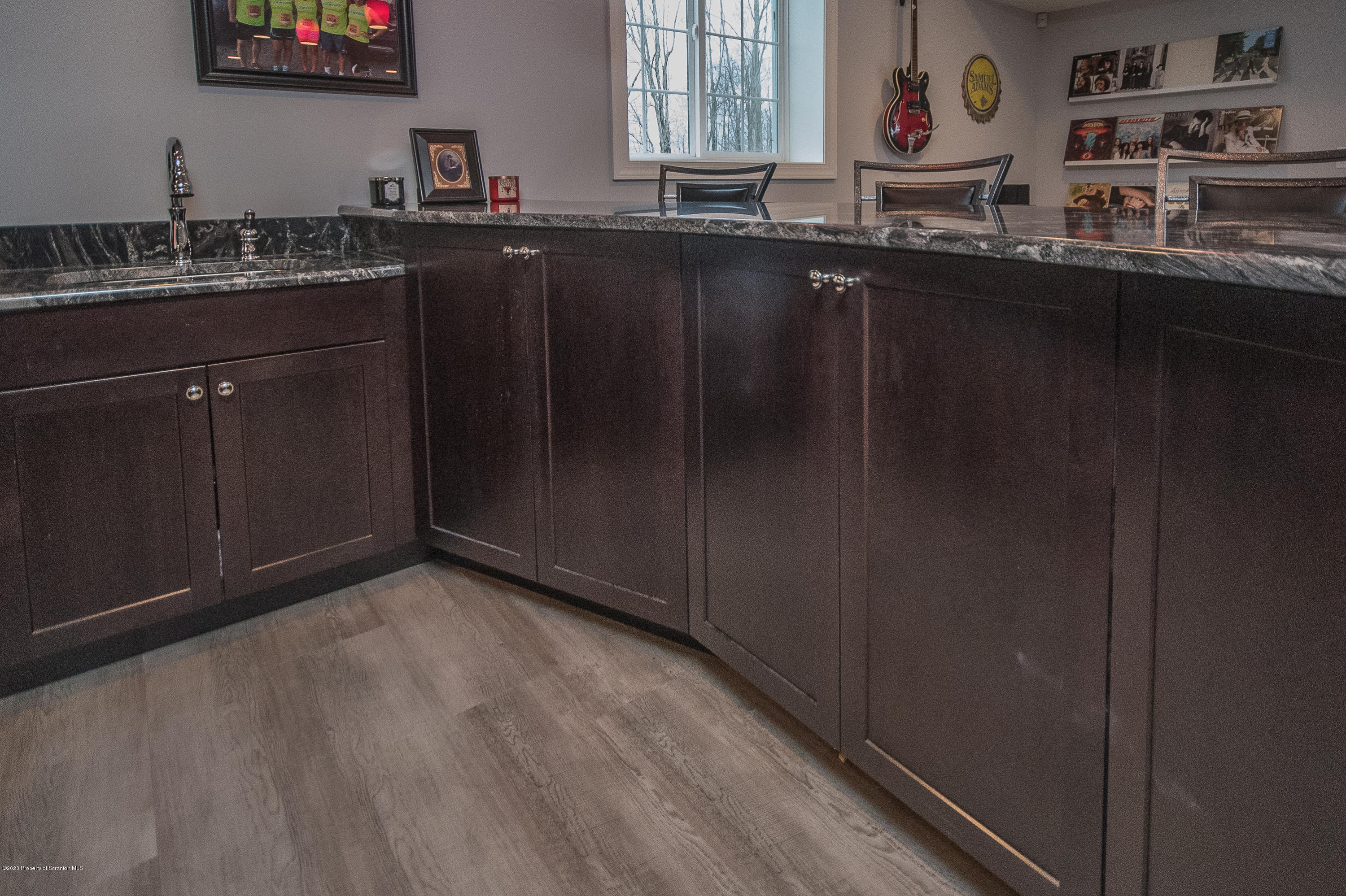 121 Highland Road Moscow, PA 18444 - Photo 46 of 93 a kitchen with granite countertop a sink and cabinets
