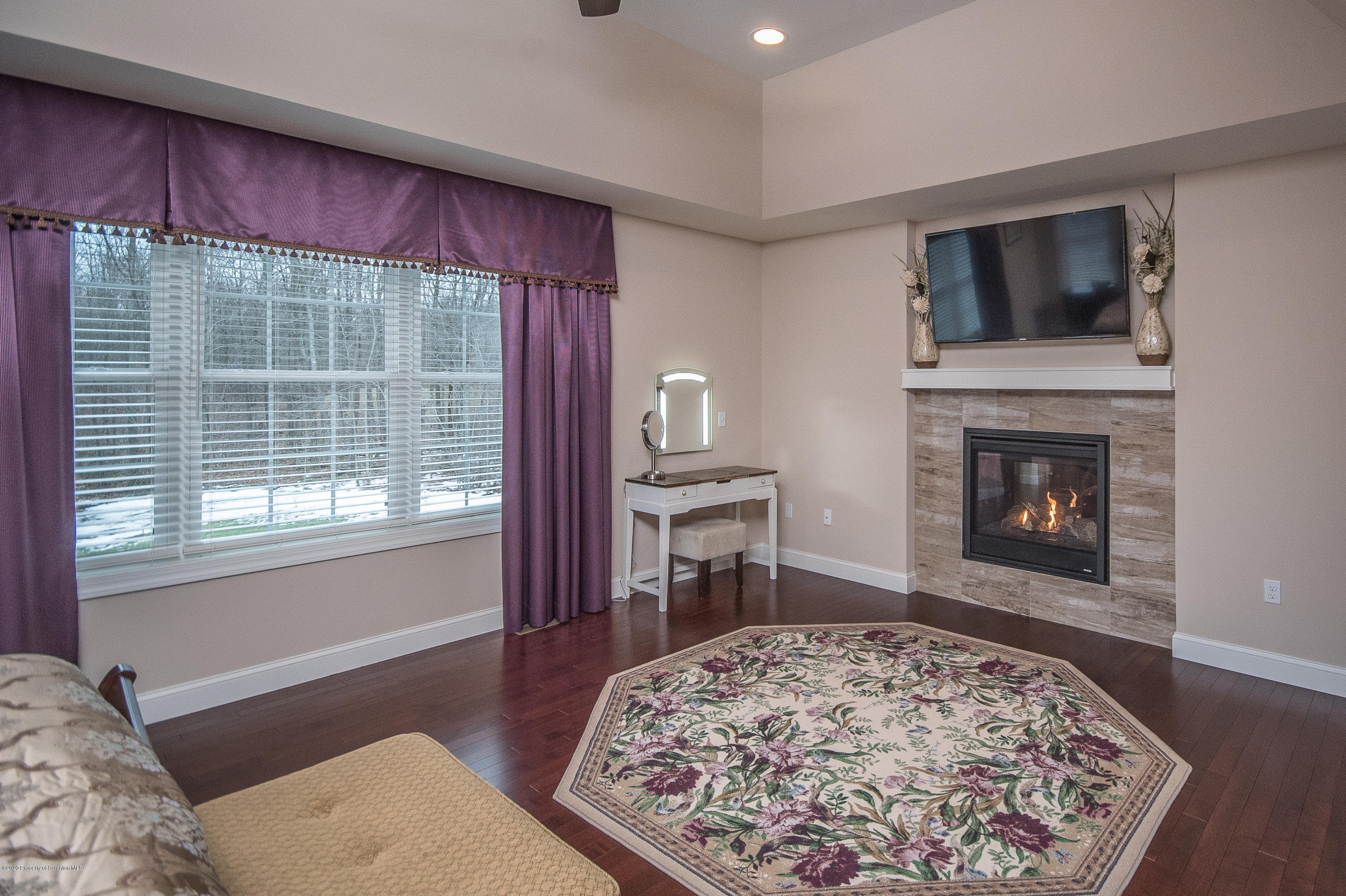 121 Highland Road Moscow, PA 18444 - Photo 49 of 93 a living room with a fireplace furniture and a flat screen tv