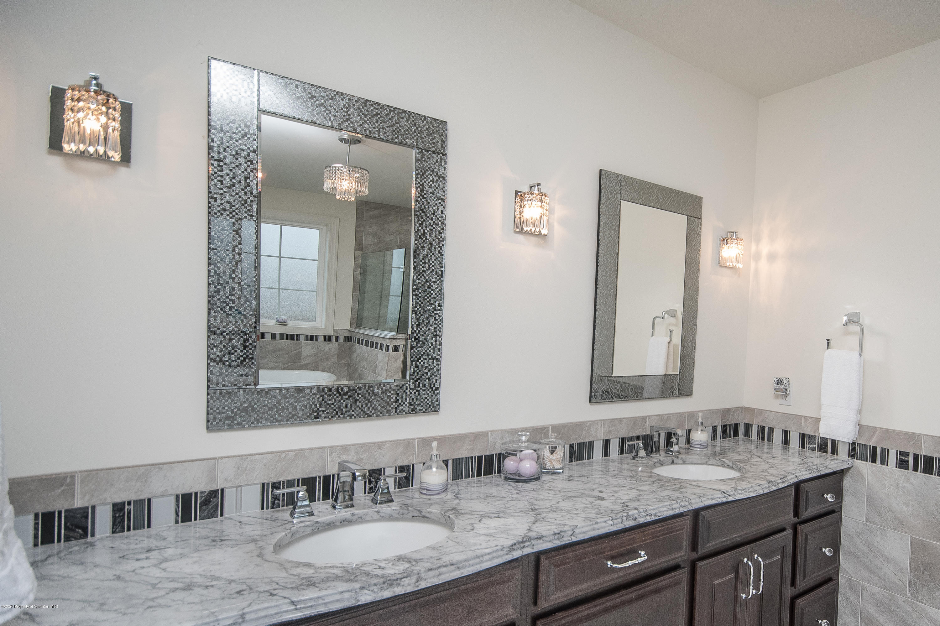 121 Highland Road Moscow, PA 18444 - Photo 54 of 93 a bathroom with double vanity sinks and a mirror