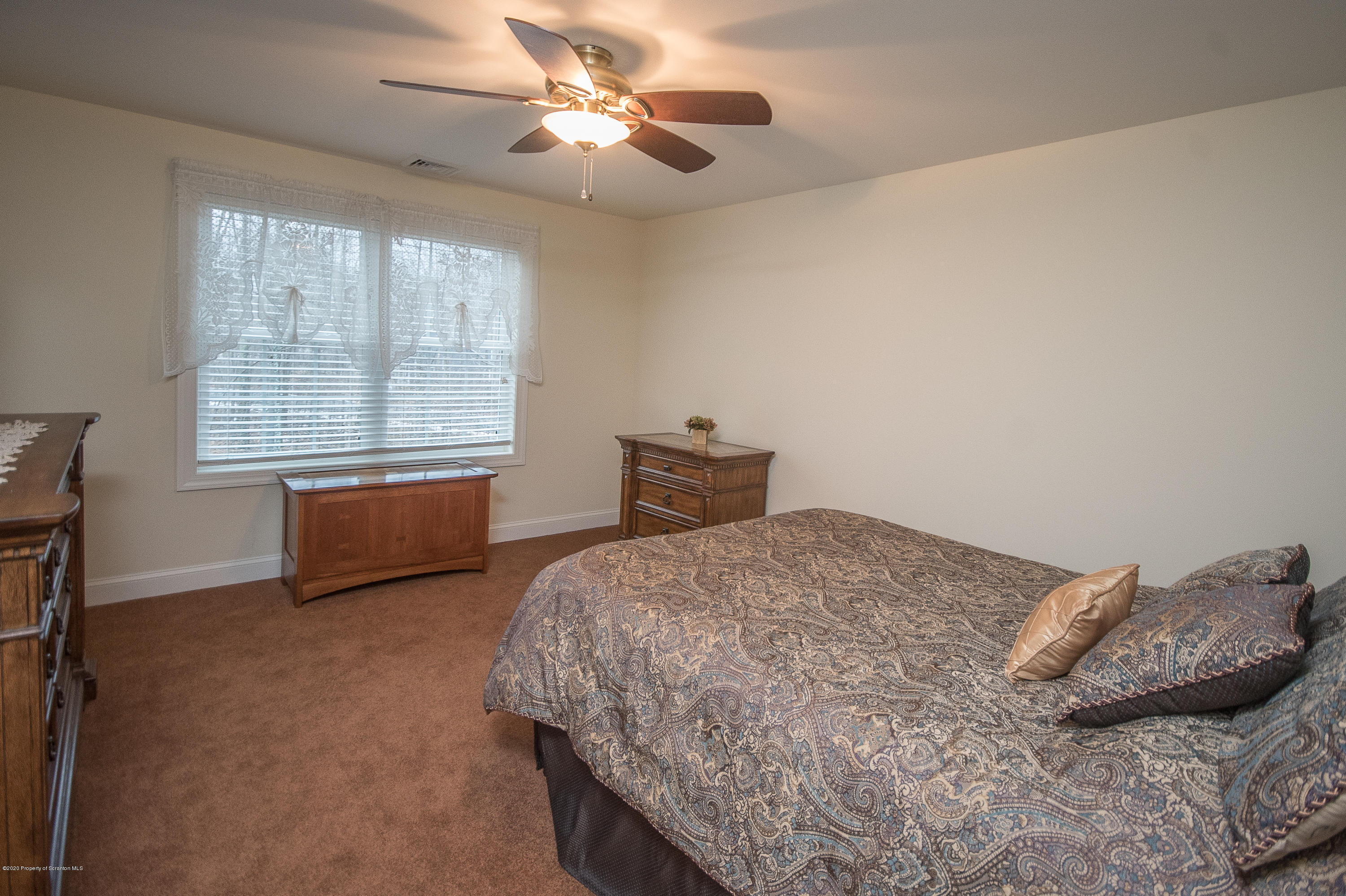 121 Highland Road Moscow, PA 18444 - Photo 61 of 93 a bedroom with a bed and a window