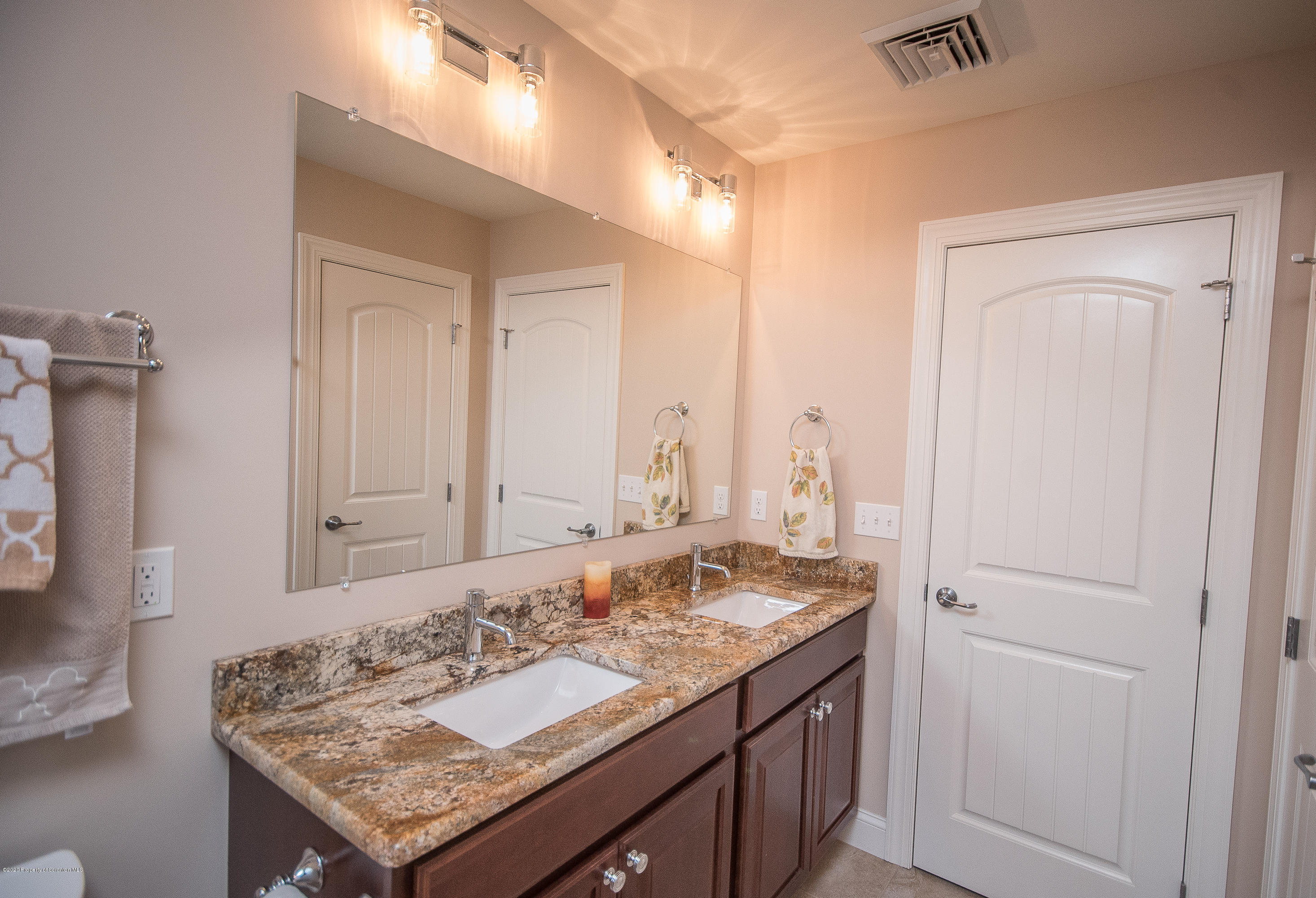 121 Highland Road Moscow, PA 18444 - Photo 73 of 93 a bathroom with a granite countertop sink and a mirror