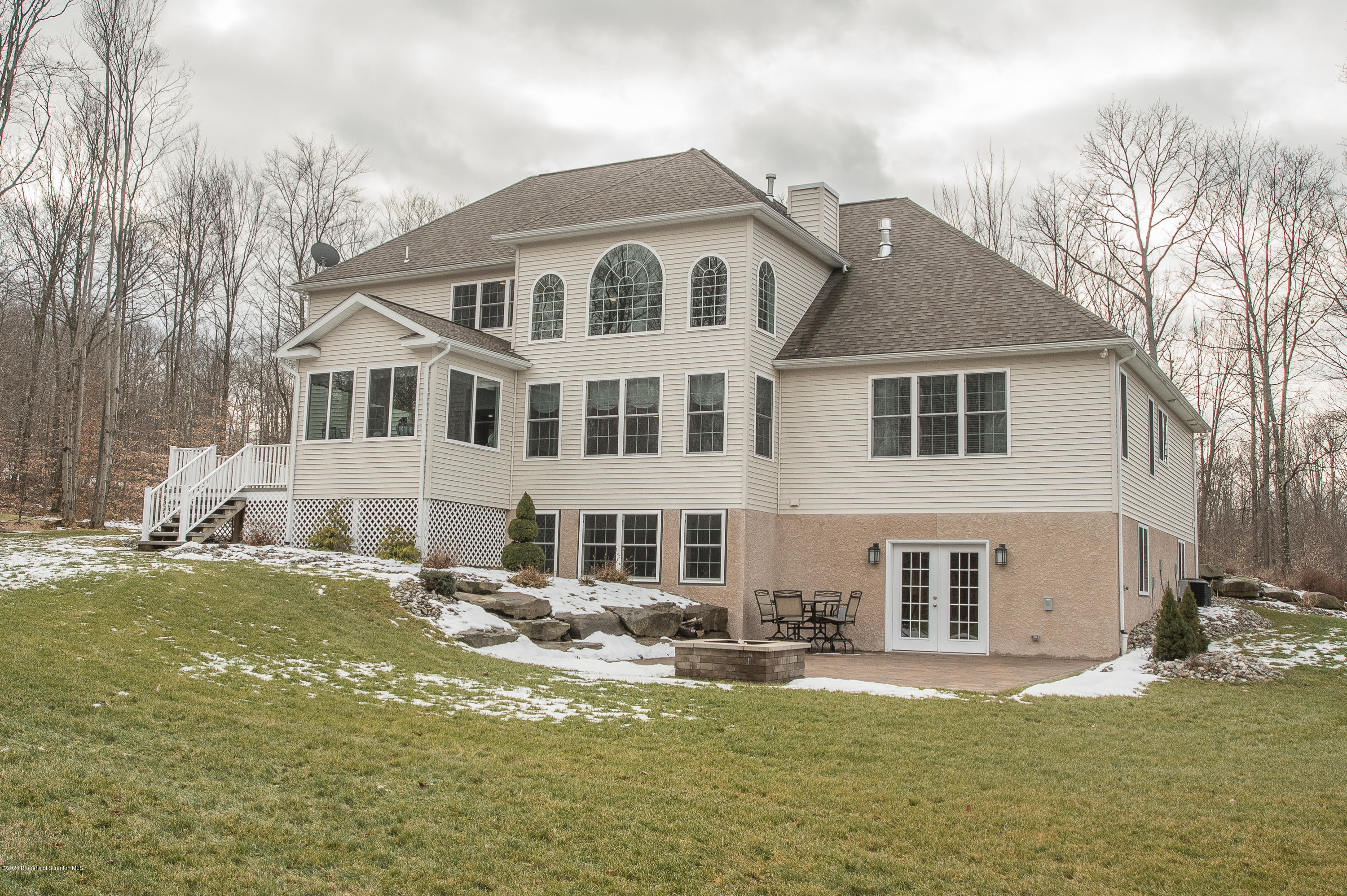 121 Highland Road Moscow, PA 18444 - Photo 86 of 93 a front view of a house with a garden