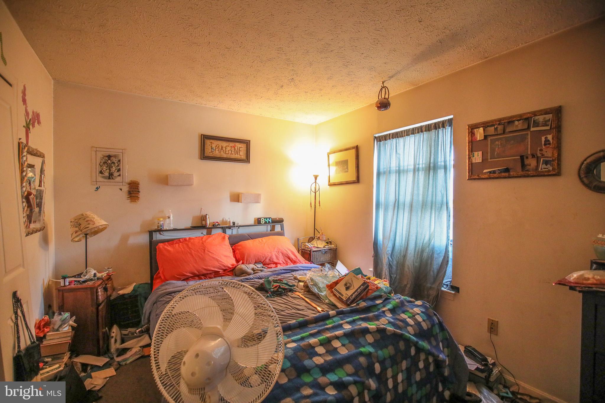 506 Imperial Square Odenton, MD 21113 - Photo 11 of 14 a bed sitting in a bedroom next to a window