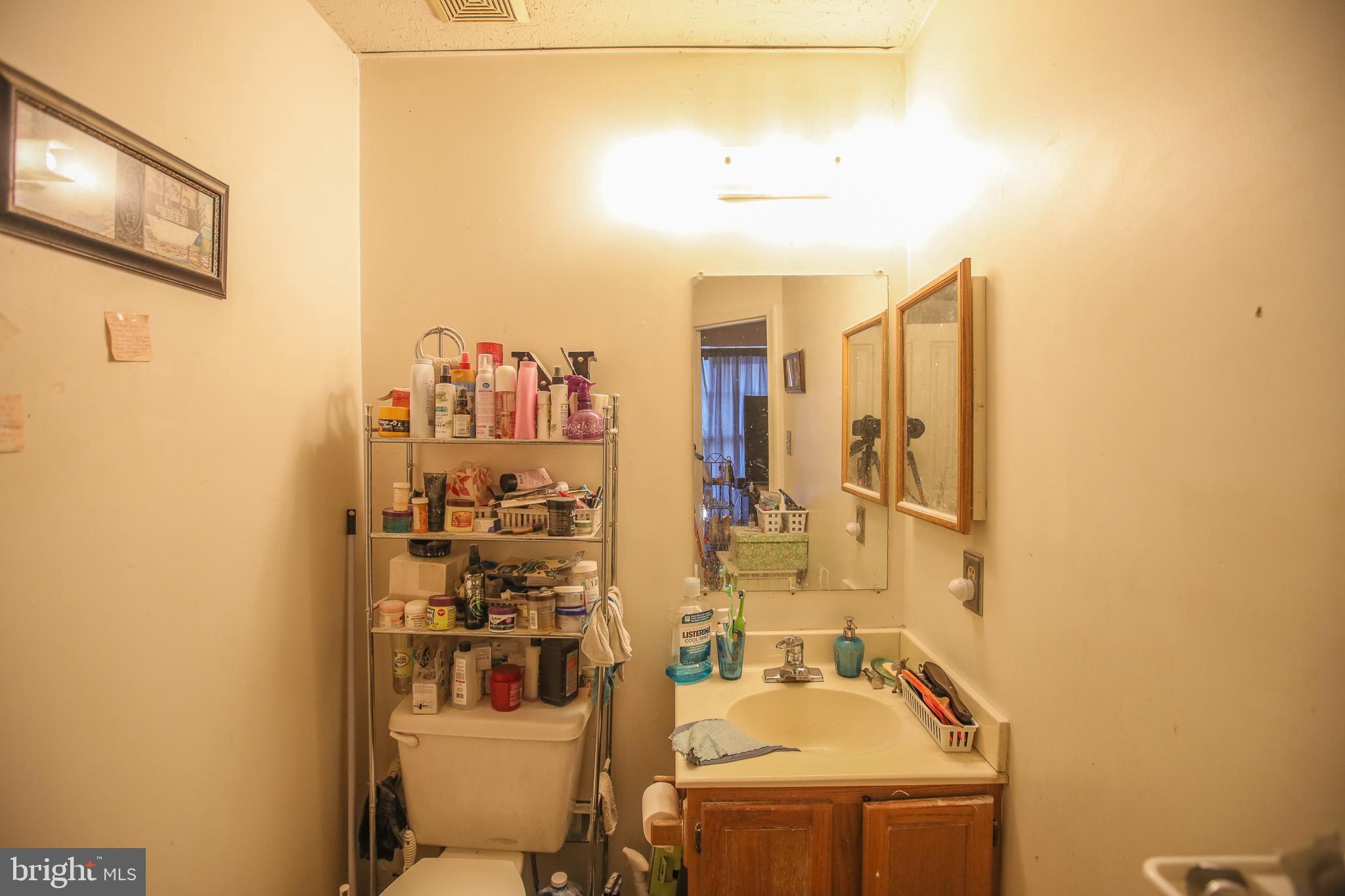 506 Imperial Square Odenton, MD 21113 - Photo 12 of 14 a bathroom with a sink and a mirror