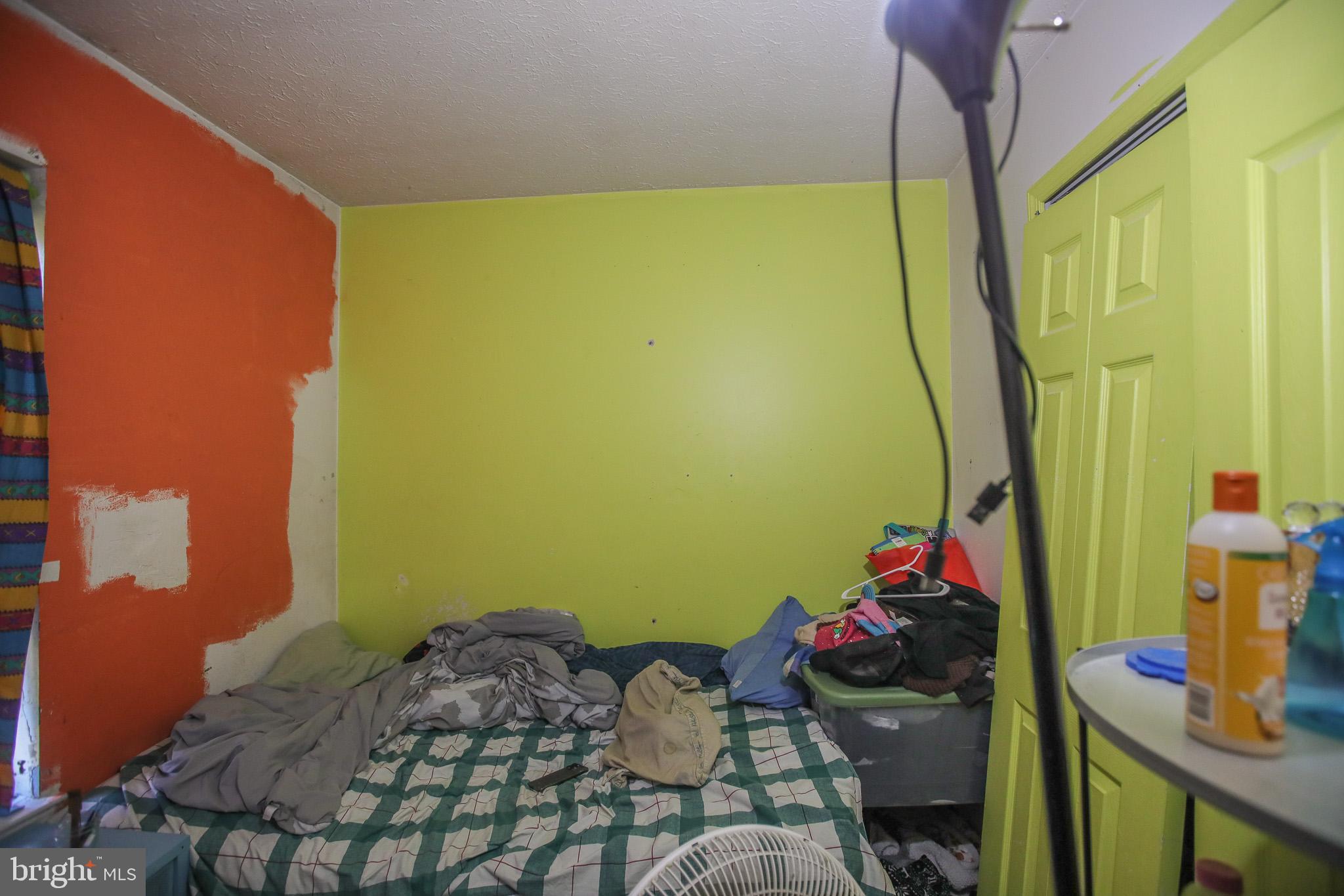 506 Imperial Square Odenton, MD 21113 - Photo 14 of 14 a bedroom with a bed and a chandelier