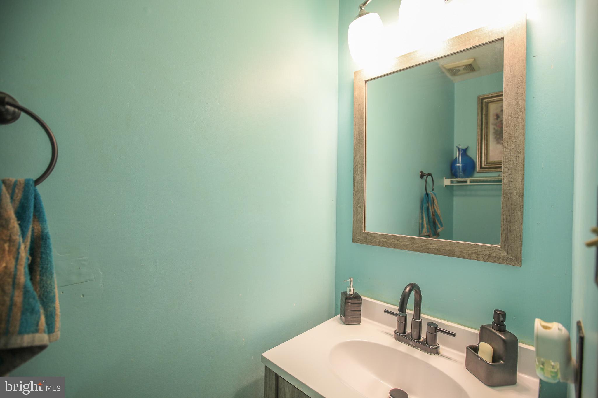 506 Imperial Square Odenton, MD 21113 - Photo 8 of 14 a bathroom with a sink and mirror