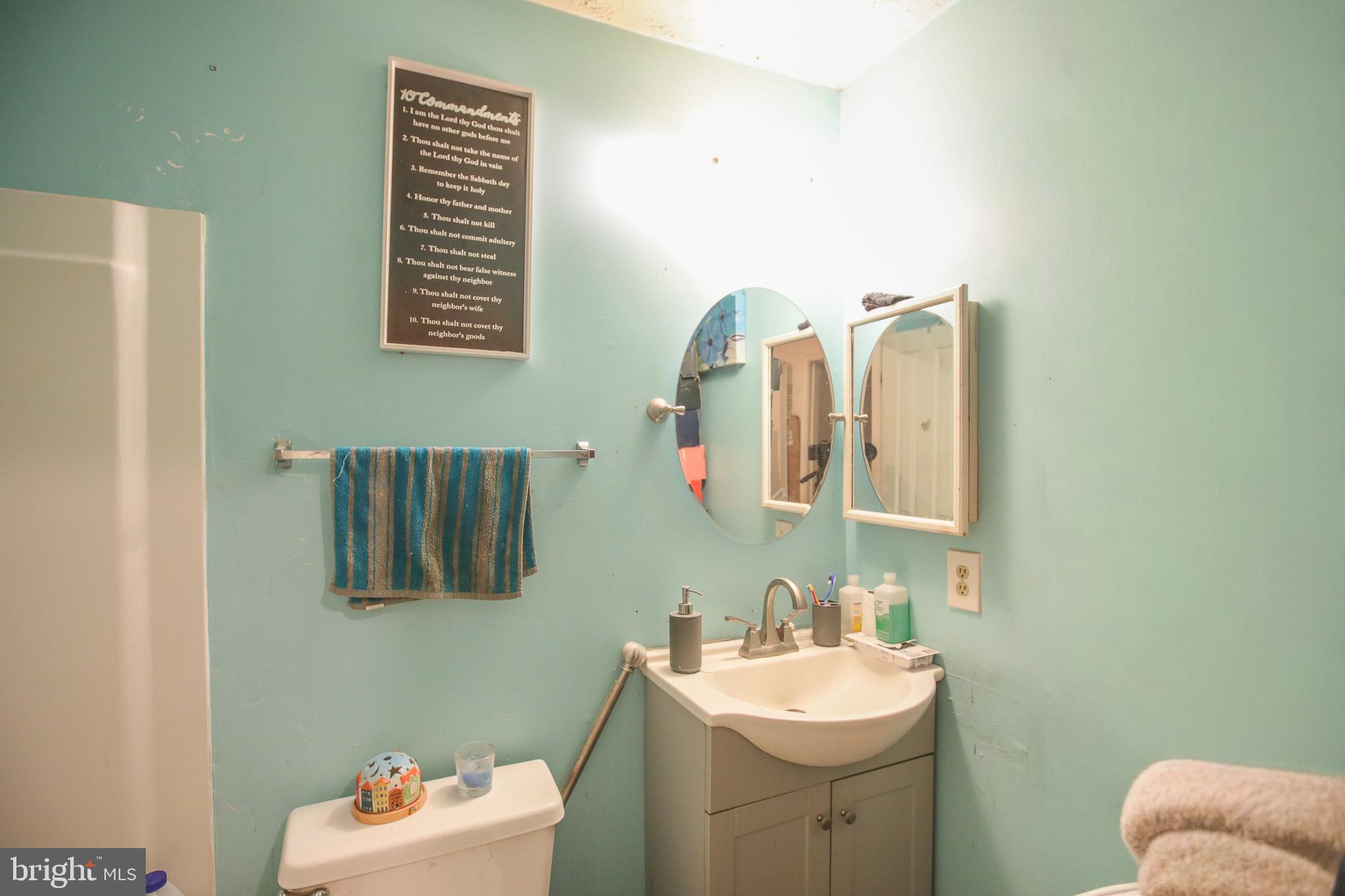 506 Imperial Square Odenton, MD 21113 - Photo 9 of 14 a bathroom with a sink mirror and vanity