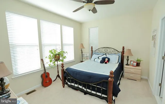 a bedroom with a bed and a table