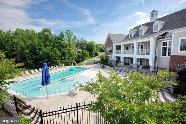 a house with lots of trees in the background