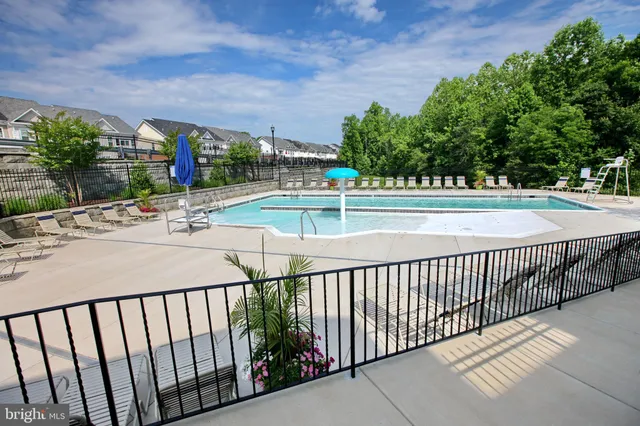 a living room with fireplace furniture and a wooden floor