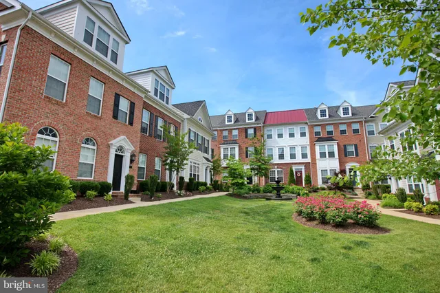 a view of a garden with flowers and trees