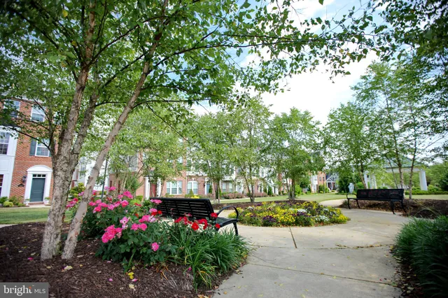 a view of a backyard with table and chairs