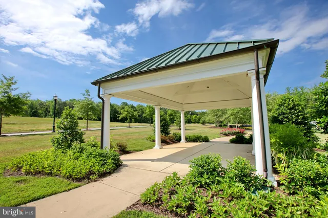 a view of a chairs and table in a backyard
