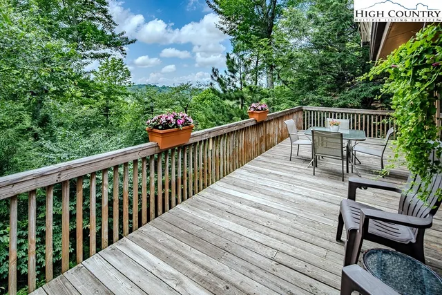 a view of a two chairs on the roof deck