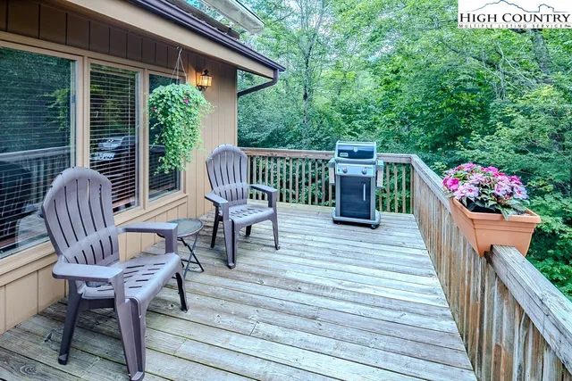 a view of two chairs in wooden deck