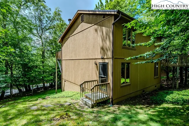 a backyard of a house with lots of green space