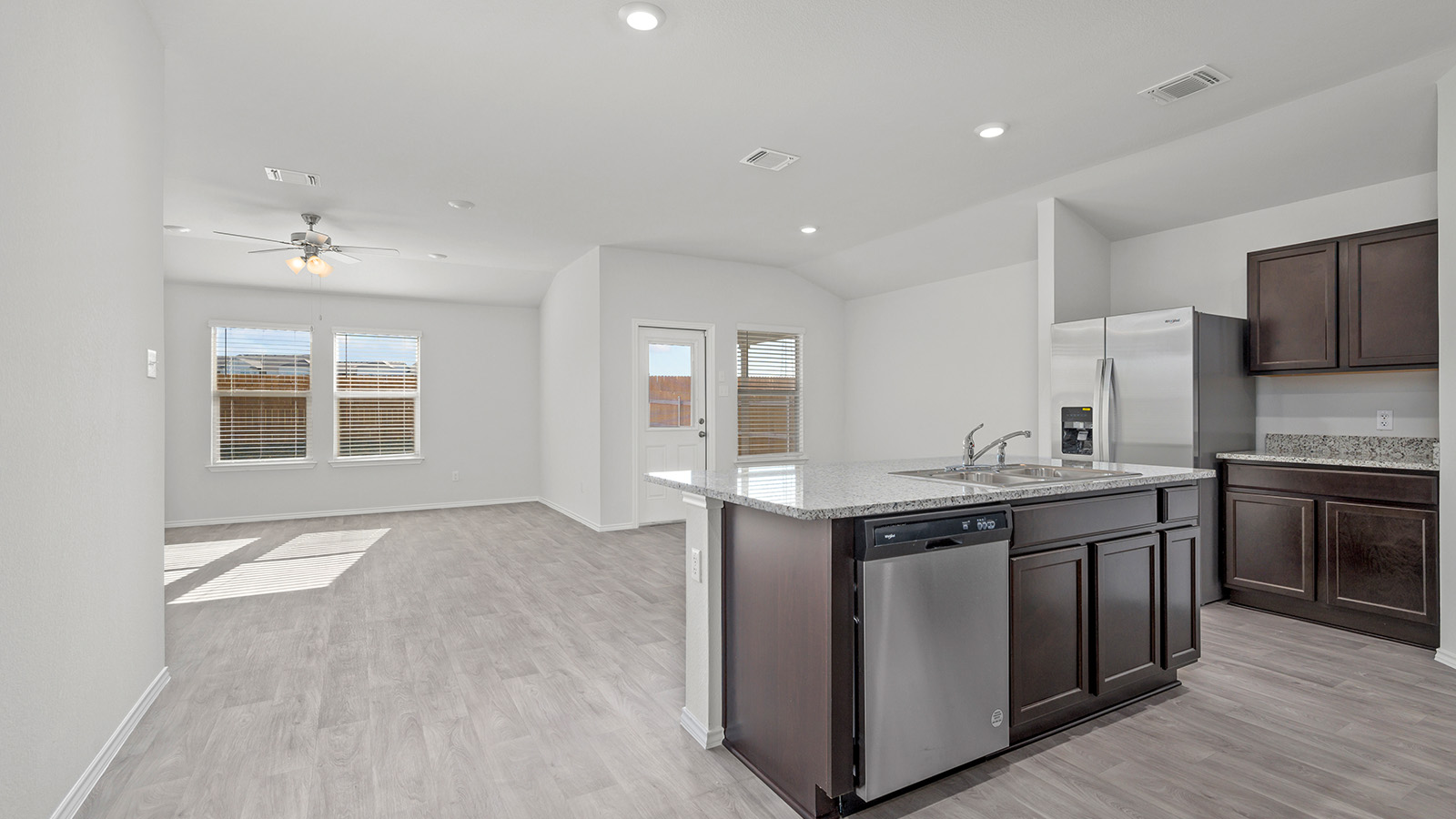 1407 Victory Rnch Trail Killeen, TX 76549 - Photo 3 of 24 An open concept kitchen features an island, ample cabinetry, and sleek stainless steel appliances.