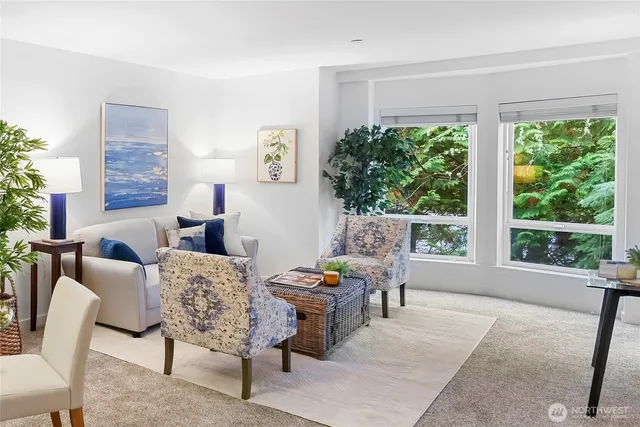 a living room with furniture and a lamp