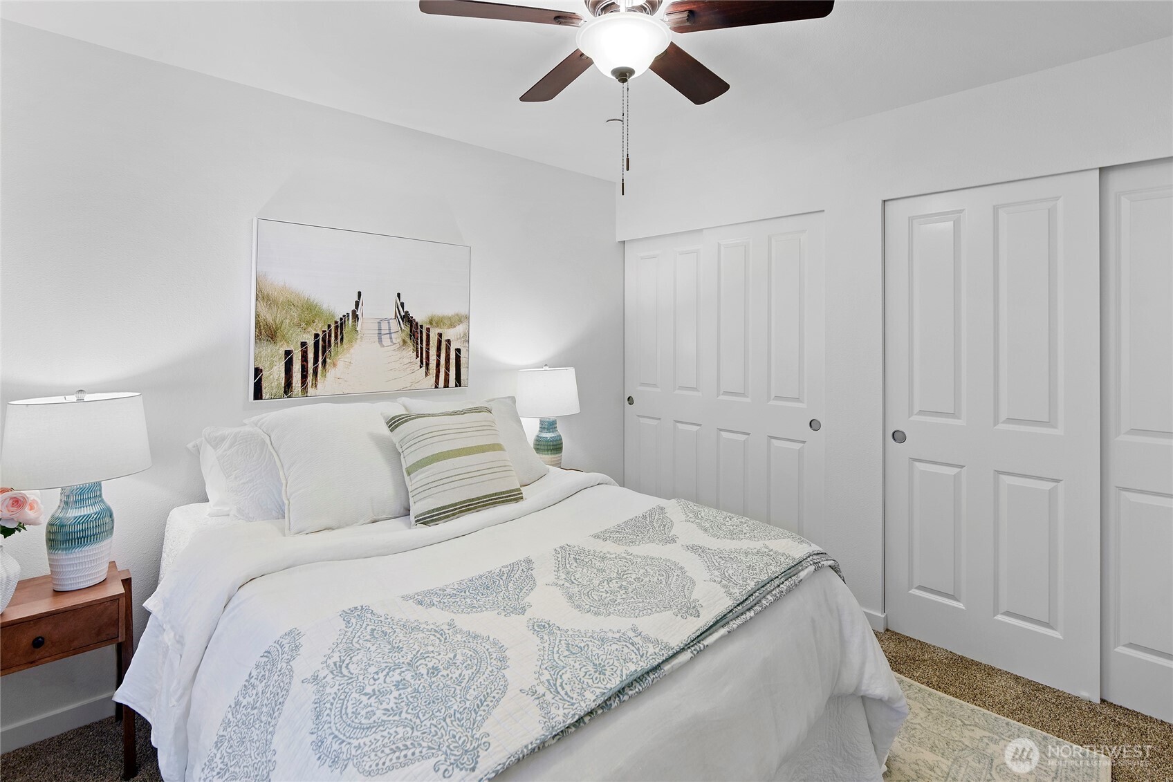 300 High School Road Northeast, Unit 314 Bainbridge Island, WA 98110 - Photo 21 of 36 a bedroom with a bed and a painting on the wall
