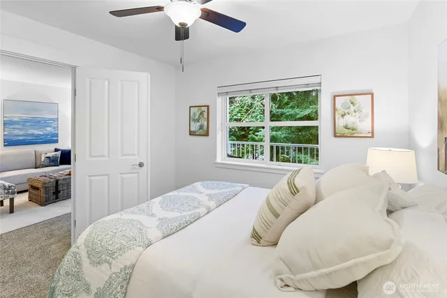 a bathroom with a shower sink vanity and toilet