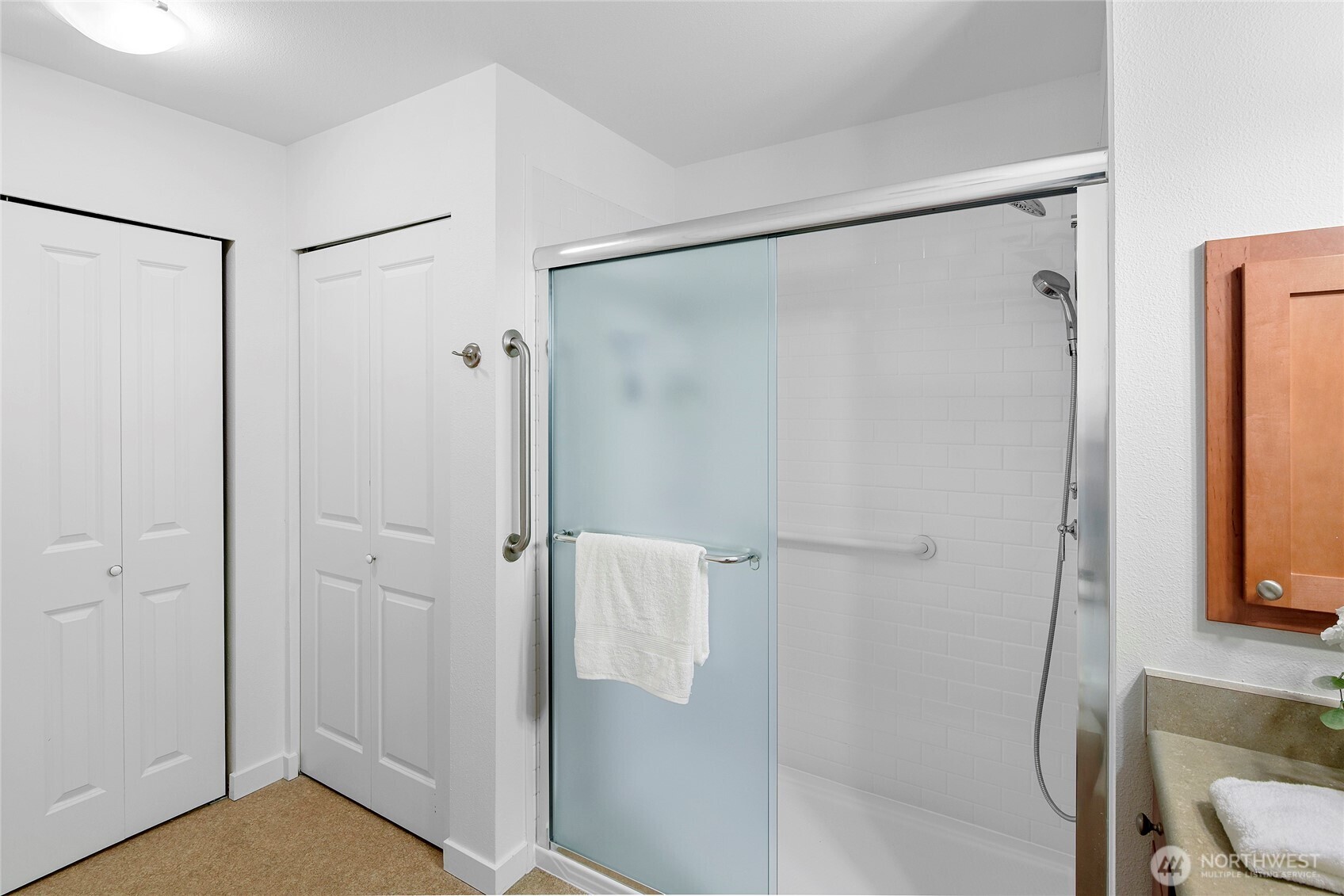 300 High School Road Northeast, Unit 314 Bainbridge Island, WA 98110 - Photo 25 of 36 a bathroom with a shower and a toilet