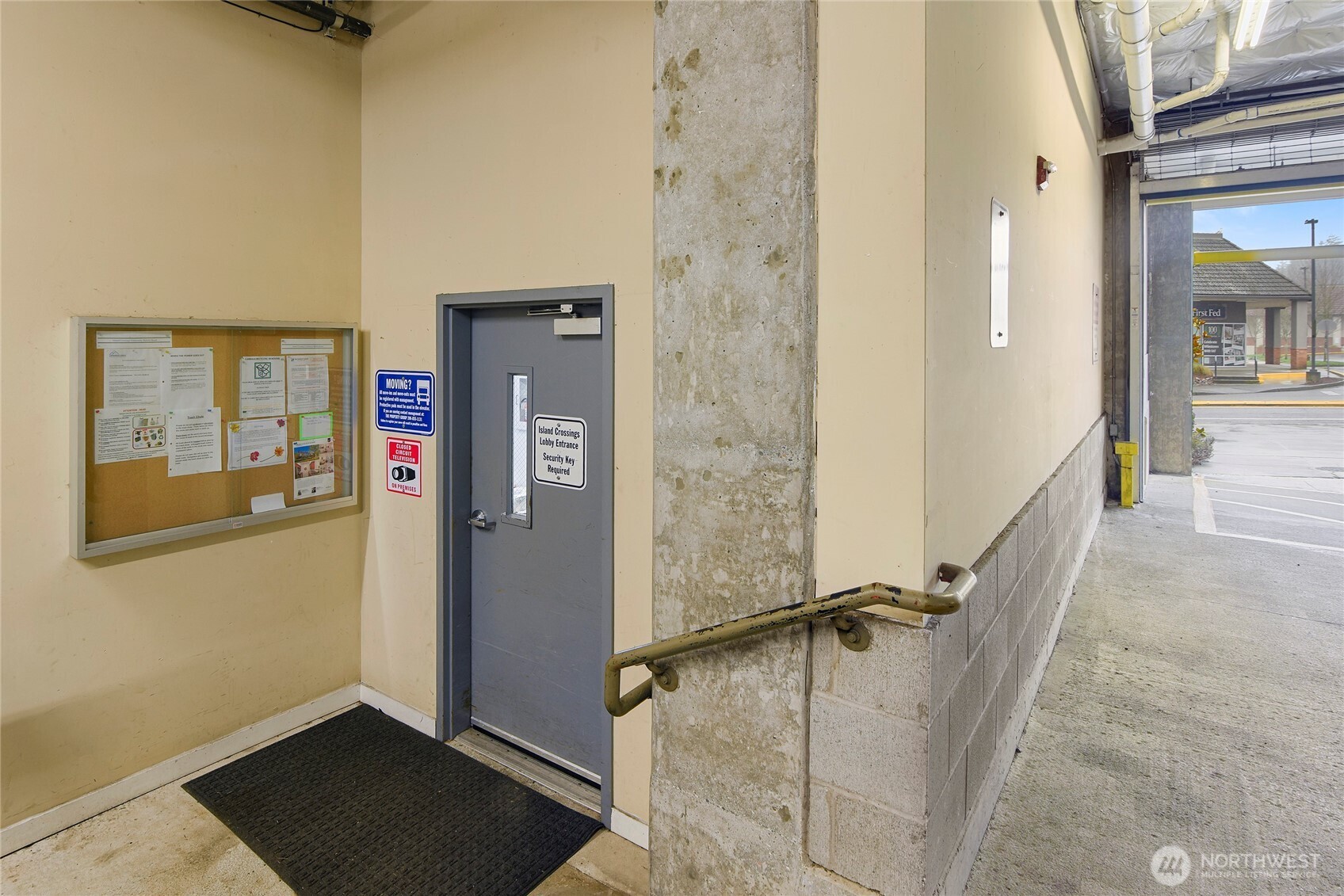 300 High School Road Northeast, Unit 314 Bainbridge Island, WA 98110 - Photo 31 of 36 a view of a hallway with wooden floor and staircase