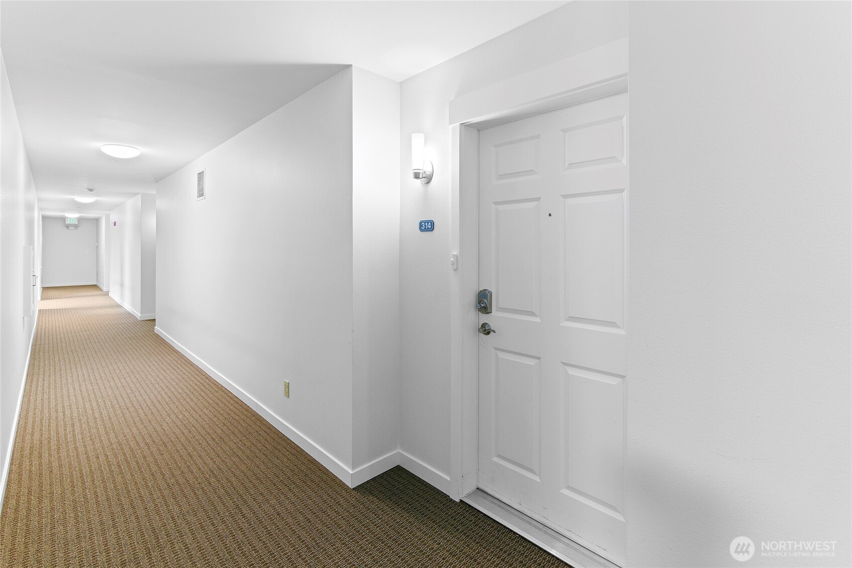 300 High School Road Northeast, Unit 314 Bainbridge Island, WA 98110 - Photo 4 of 36 a view of a hallway with wooden floor