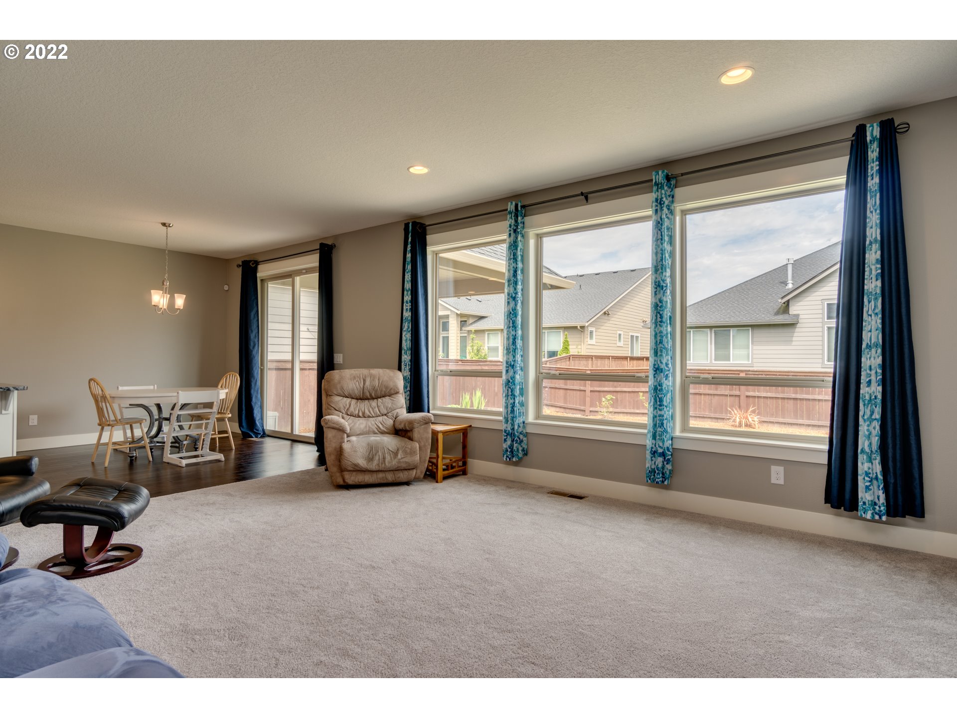 1626 South 46th Place Ridgefield, WA 98642 - Photo 12 of 32 a living room with furniture and large windows