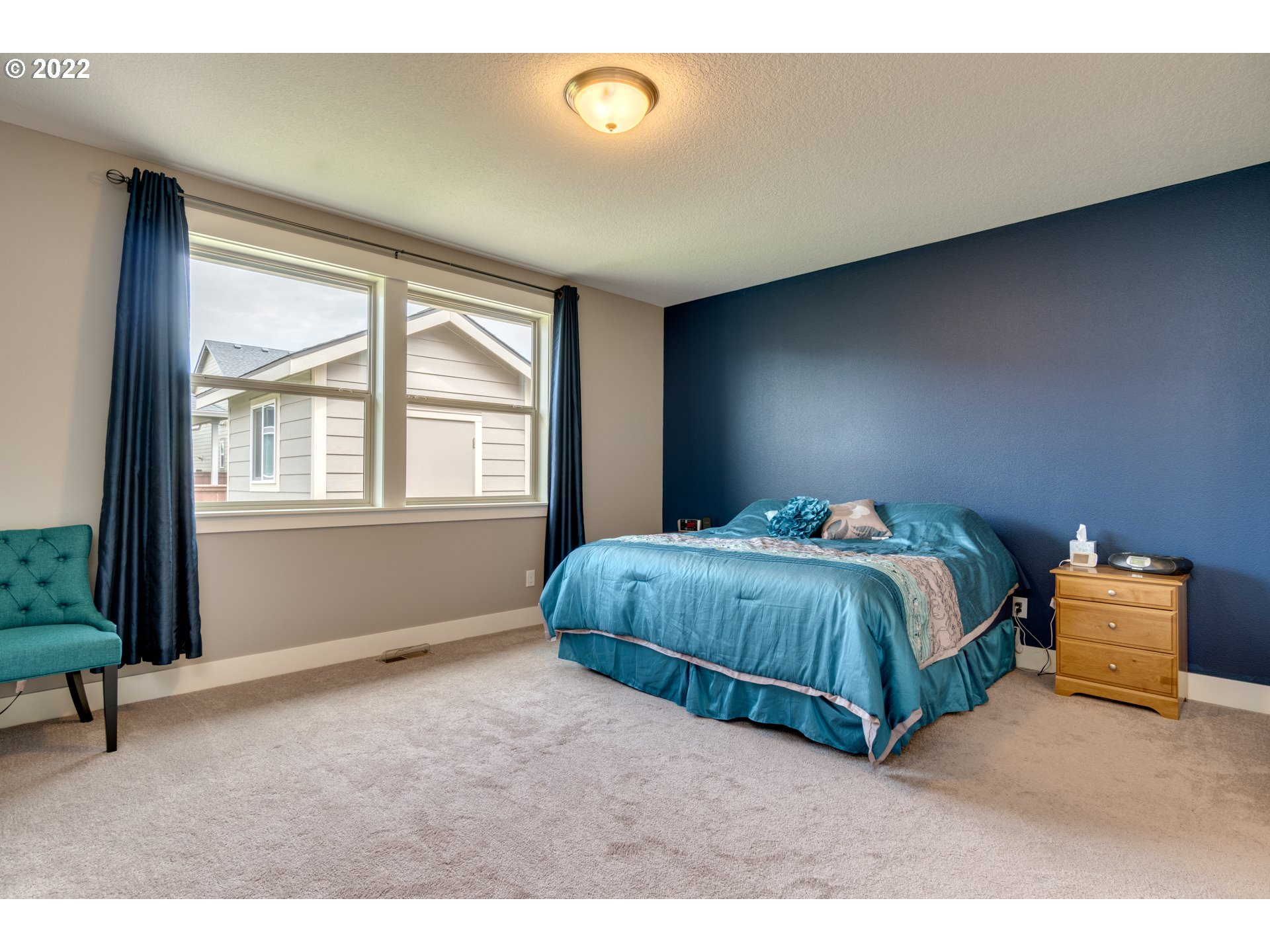 1626 South 46th Place Ridgefield, WA 98642 - Photo 13 of 32 a bedroom with a bed and window