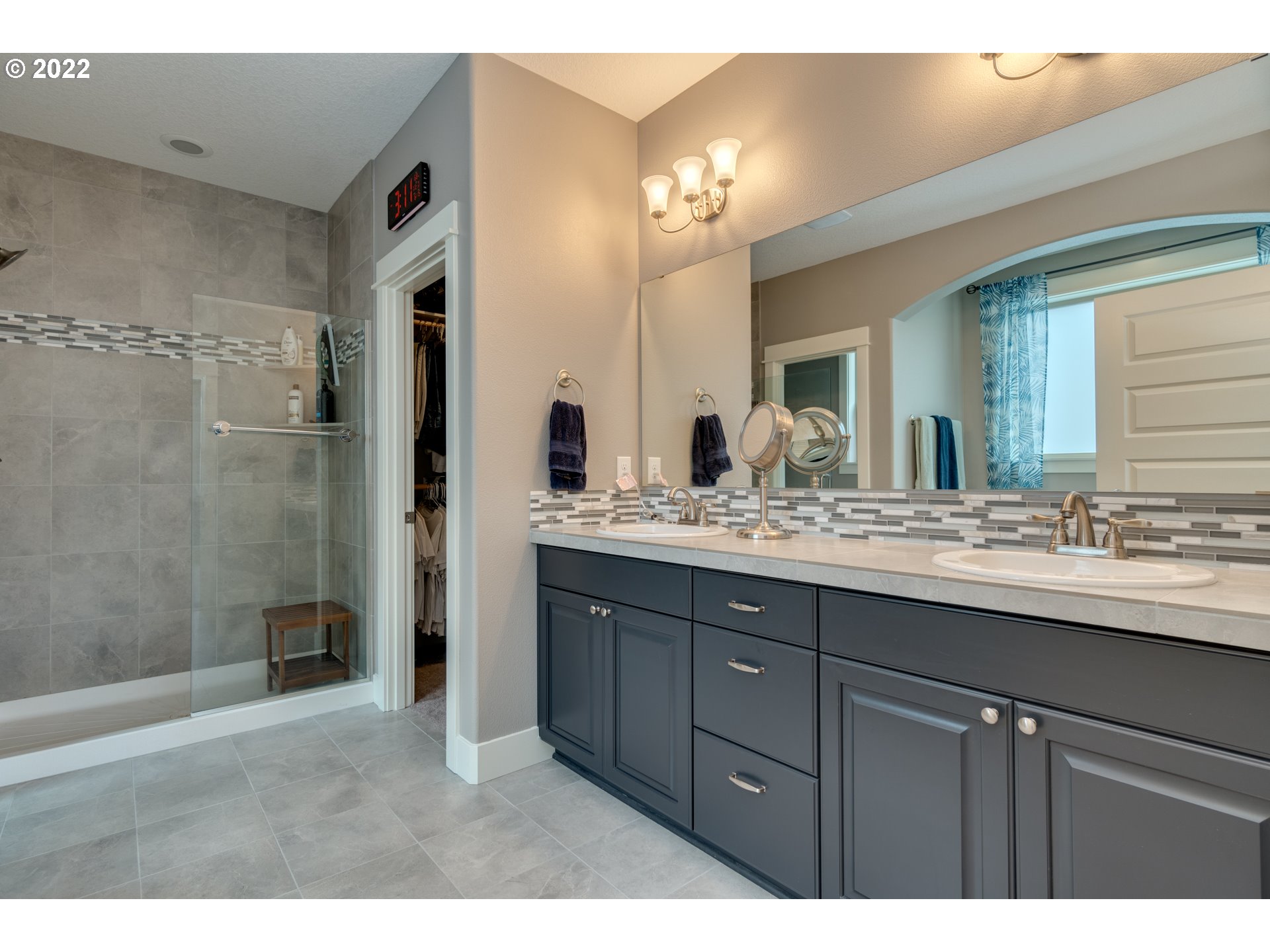 1626 South 46th Place Ridgefield, WA 98642 - Photo 14 of 32 a bathroom with a double vanity sink and a mirror