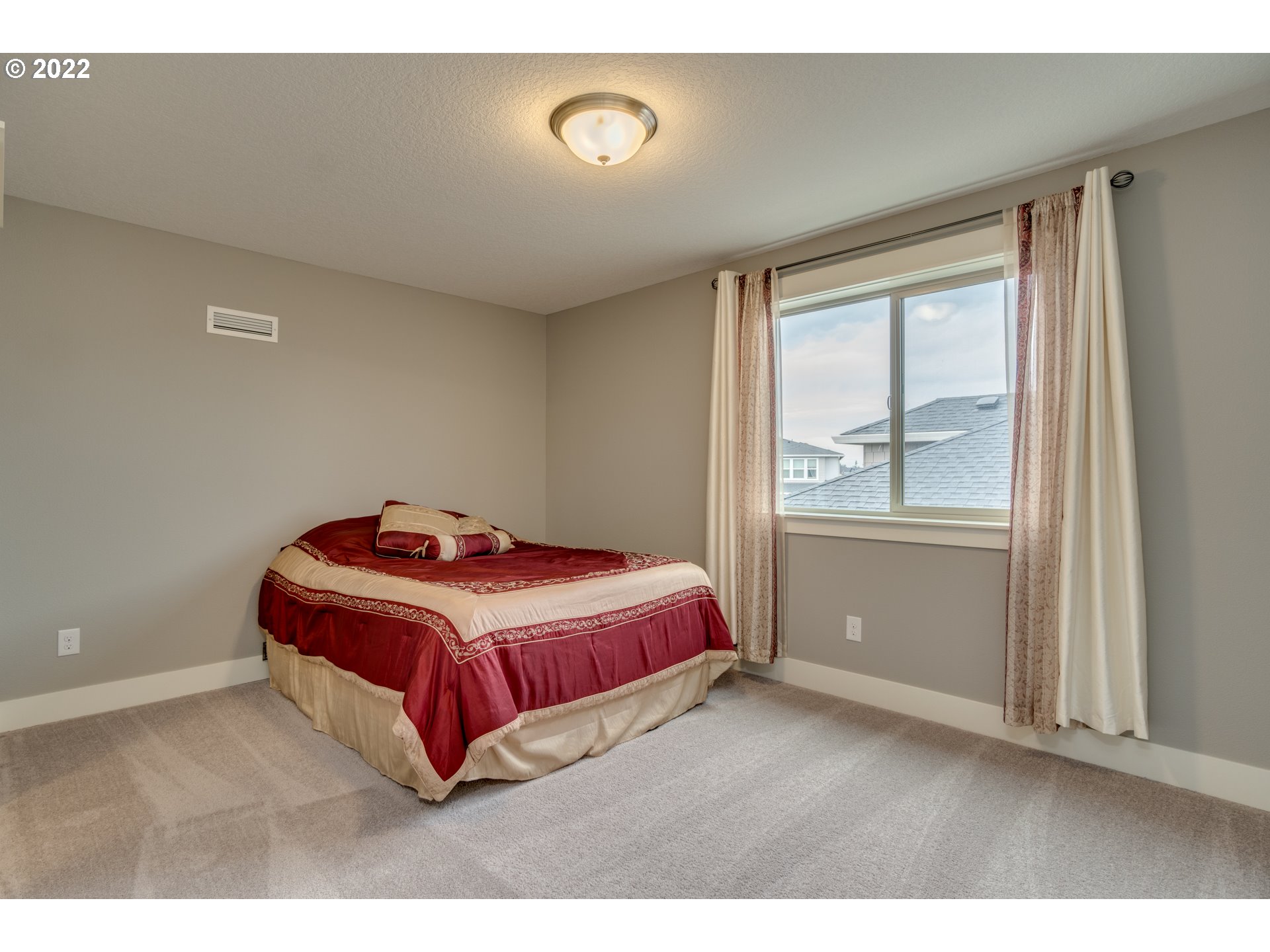 1626 South 46th Place Ridgefield, WA 98642 - Photo 18 of 32 a bedroom with a bed and window