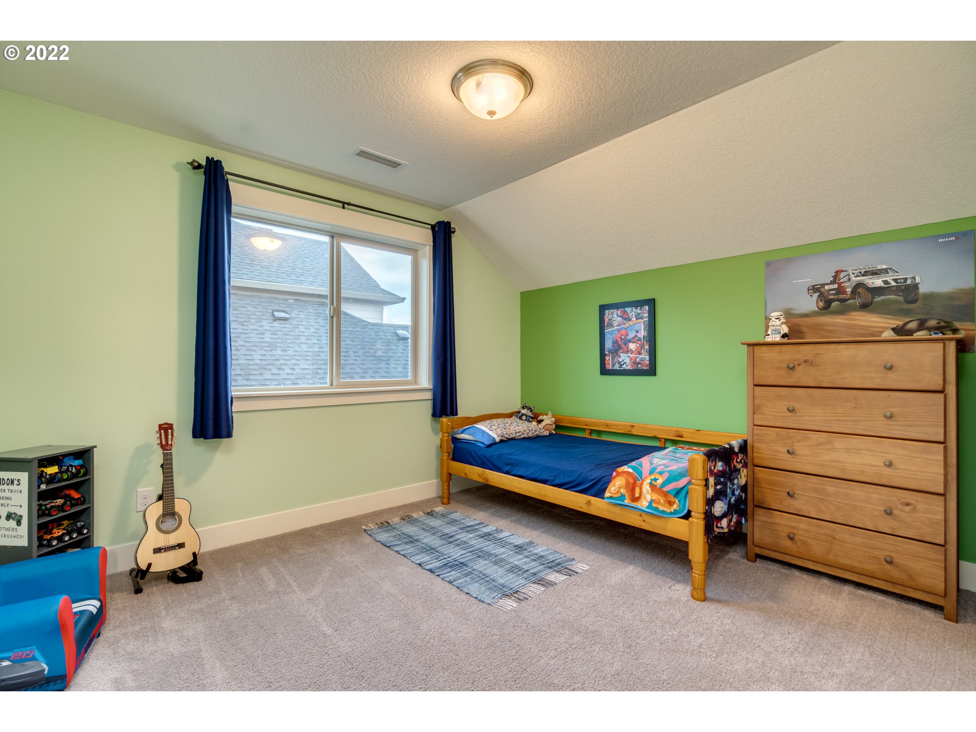 1626 South 46th Place Ridgefield, WA 98642 - Photo 20 of 32 a bedroom with a bed and a dresser