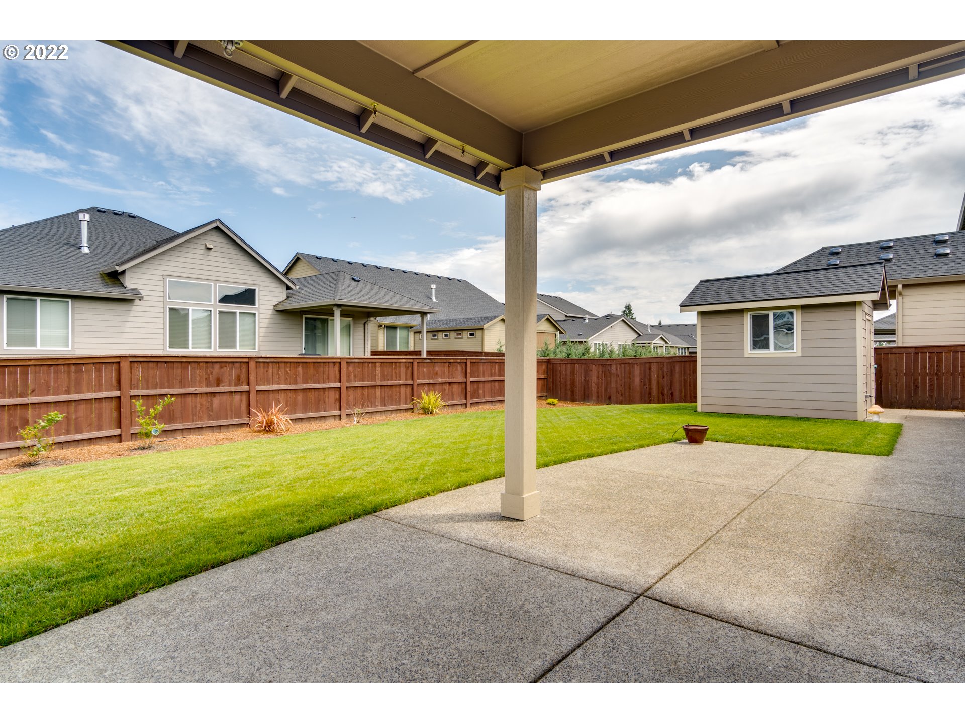 1626 South 46th Place Ridgefield, WA 98642 - Photo 23 of 32 a view of an house with backyard and a tree