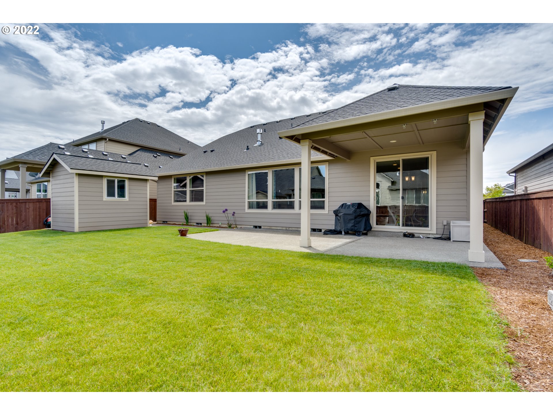 1626 South 46th Place Ridgefield, WA 98642 - Photo 24 of 32 a front view of house with yard and seating area