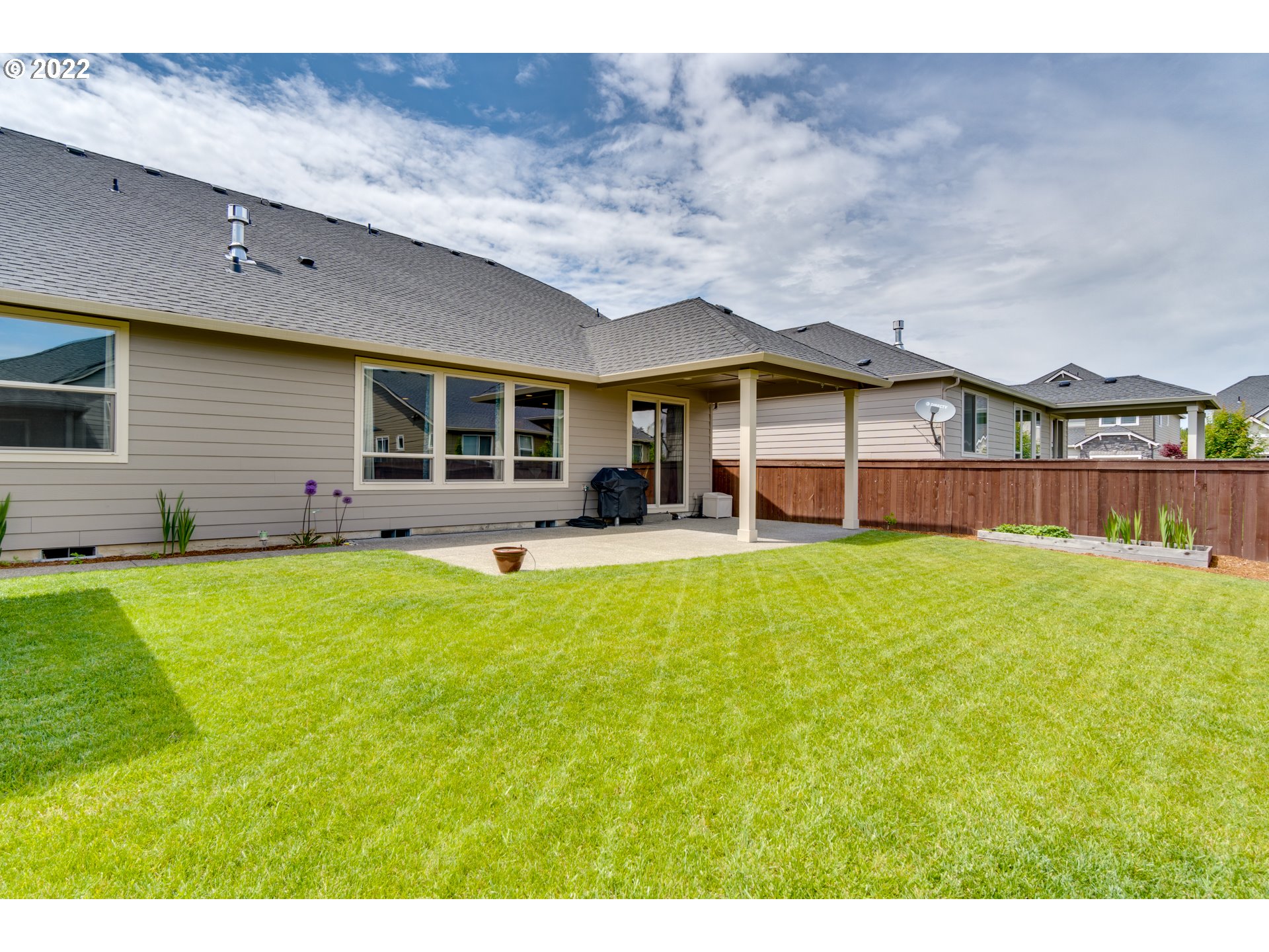 1626 South 46th Place Ridgefield, WA 98642 - Photo 25 of 32 a view of a house with a backyard and a patio