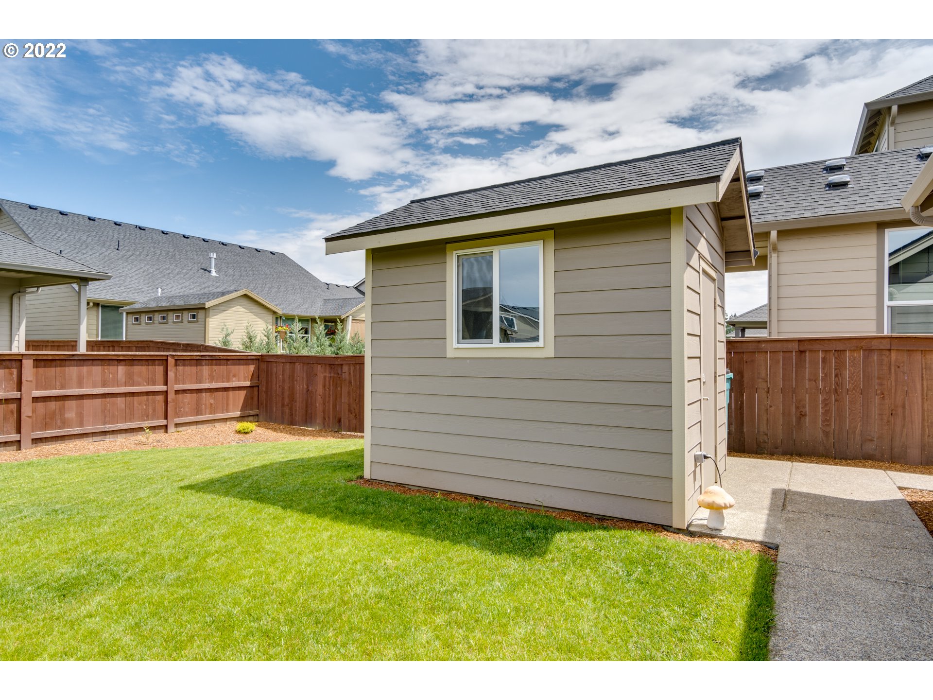 1626 South 46th Place Ridgefield, WA 98642 - Photo 27 of 32 a backyard of a house with lots of green space