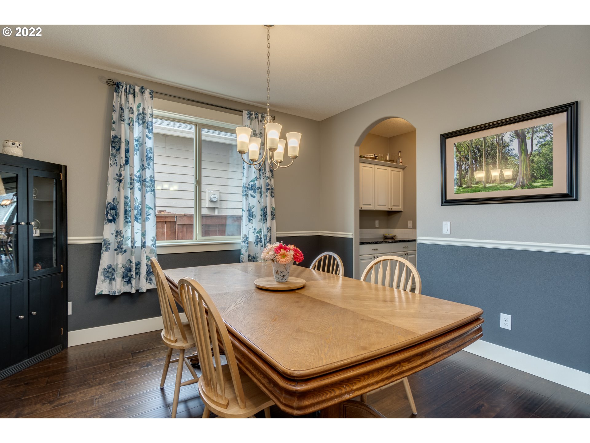 1626 South 46th Place Ridgefield, WA 98642 - Photo 10 of 32 a view of a dining room with furniture window and wooden floor